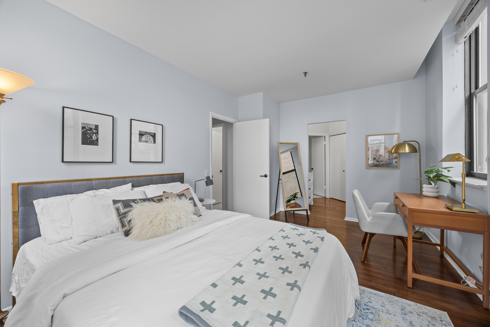 740 South Federal Street, Unit 710 Chicago, IL 60605 - Photo 14 of 23 a bedroom with a bed a table and chair