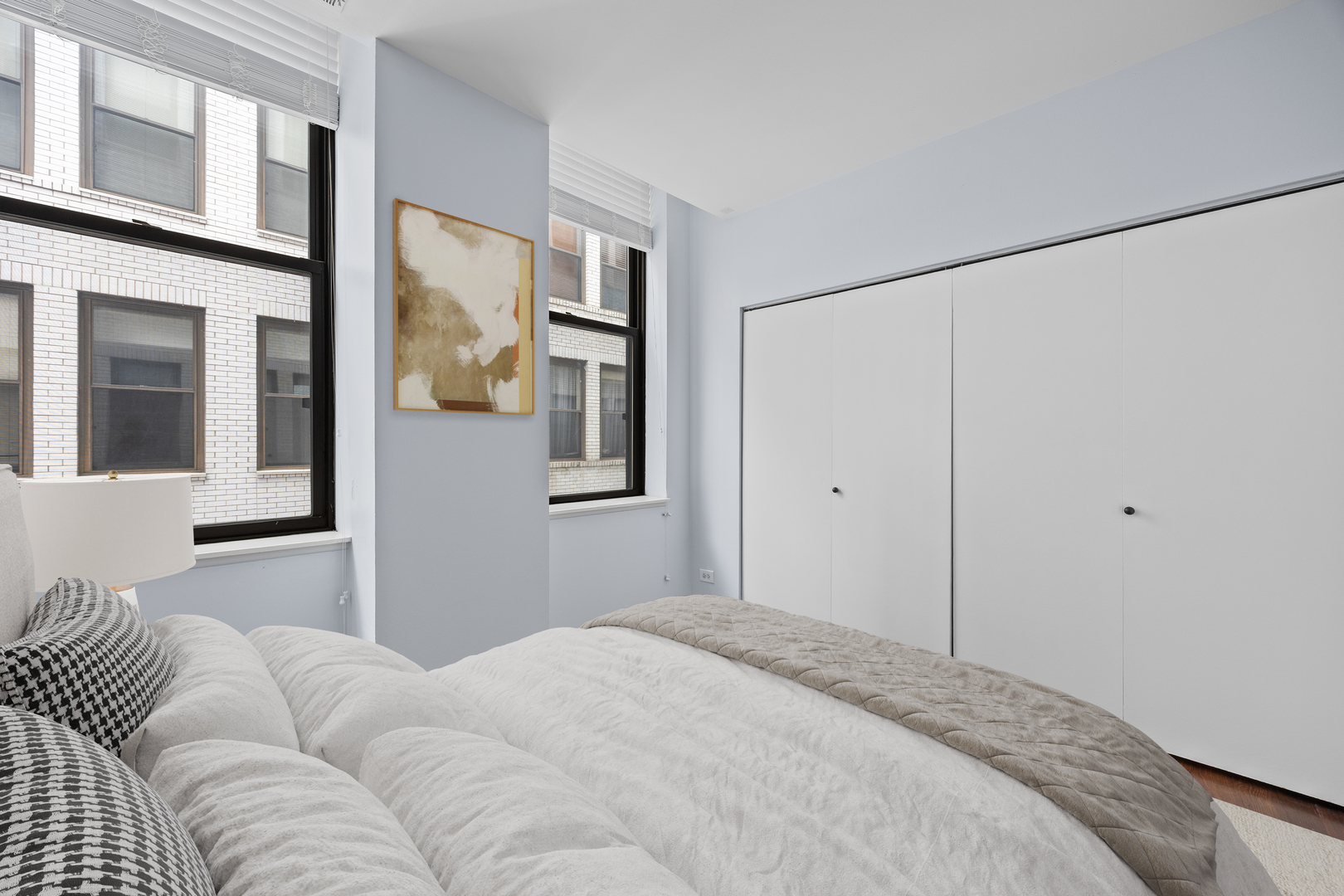 740 South Federal Street, Unit 710 Chicago, IL 60605 - Photo 18 of 23 a bedroom with a couch ceiling fan and a window