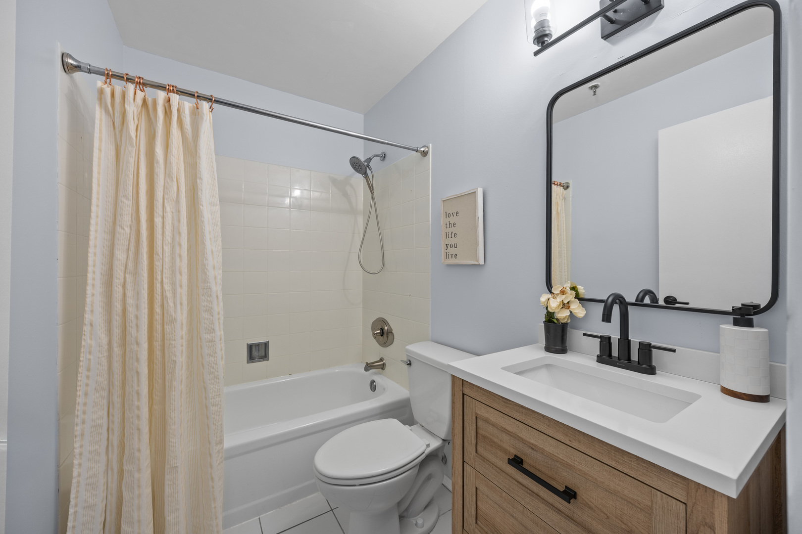 740 South Federal Street, Unit 710 Chicago, IL 60605 - Photo 19 of 23 a bathroom with a sink a toilet and a mirror