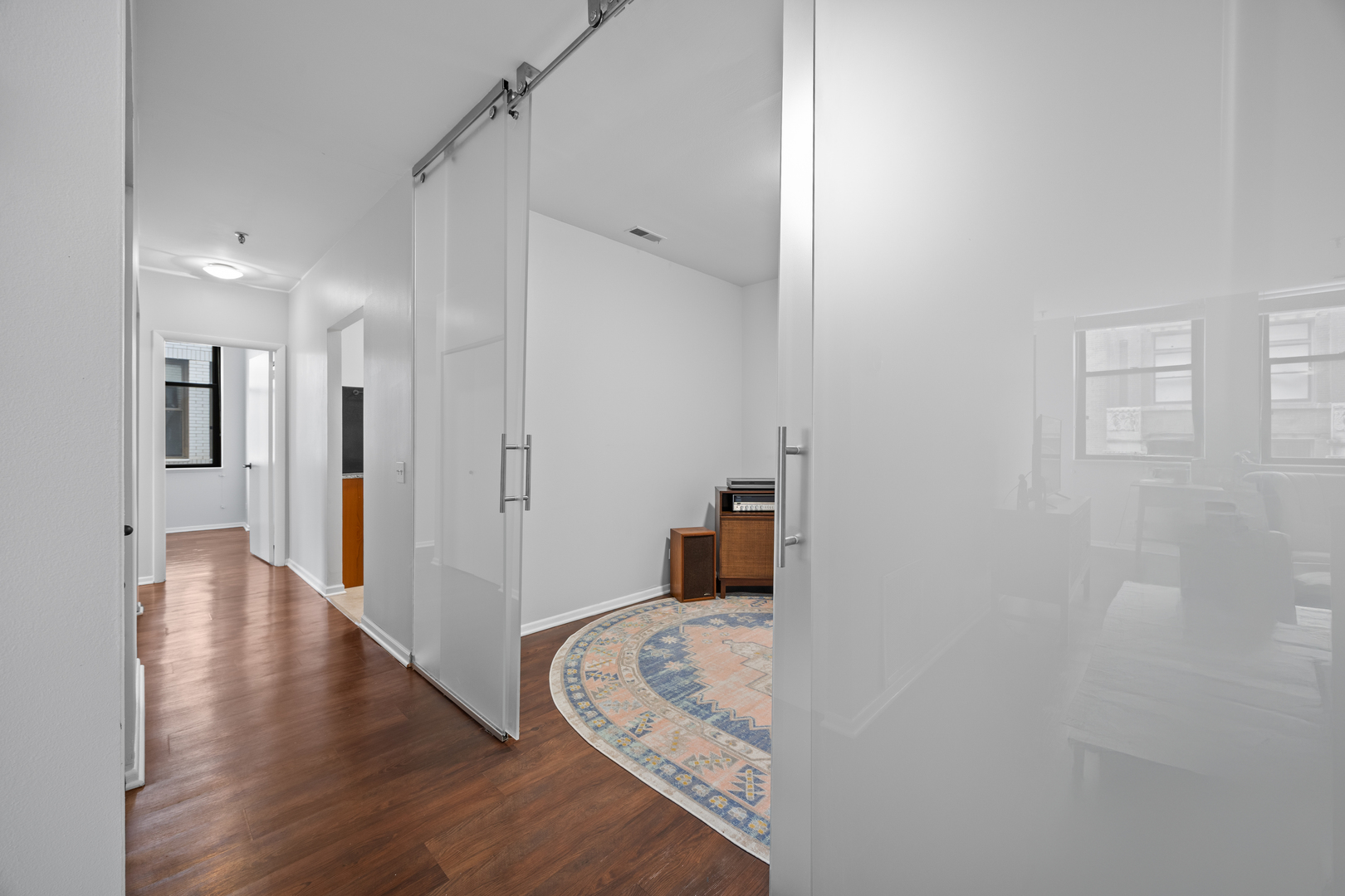 740 South Federal Street, Unit 710 Chicago, IL 60605 - Photo 9 of 23 a view of a hallway with wooden floor and cabinet