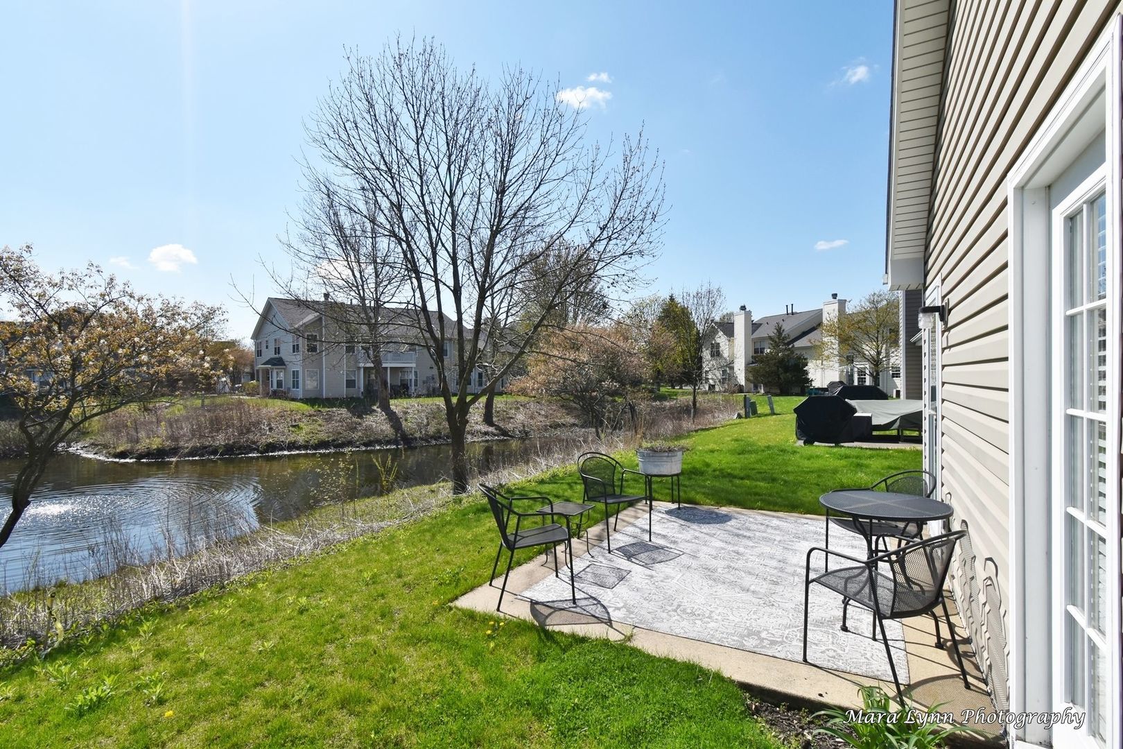 54 Jericho Lane Batavia, IL 60510 - Photo 27 of 29 a view of a lake with a house in the background