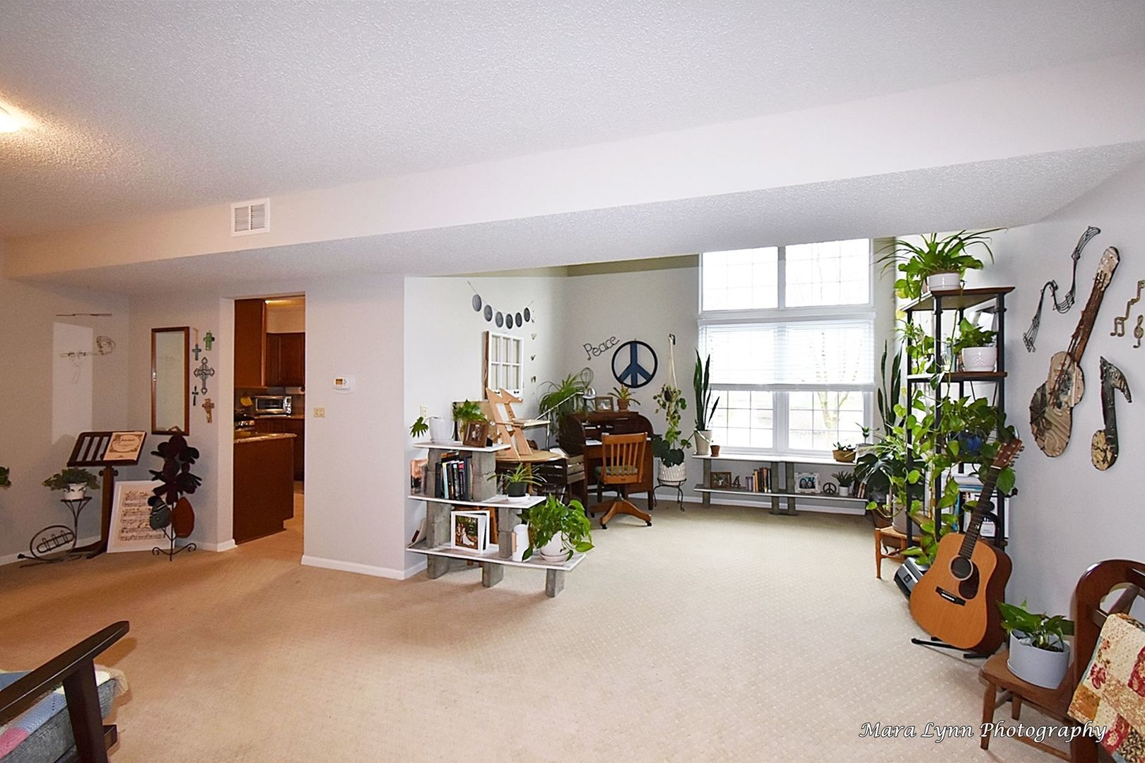 54 Jericho Lane Batavia, IL 60510 - Photo 4 of 29 a view of a room with gym equipment and a large window