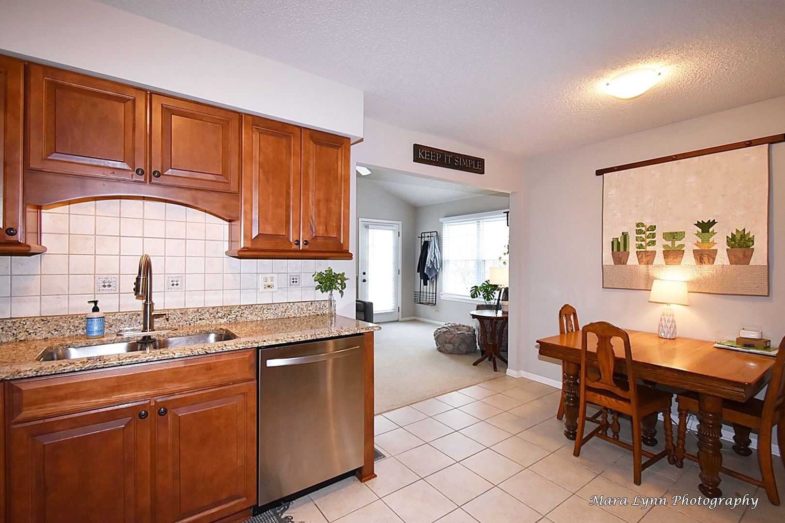 54 Jericho Lane Batavia, IL 60510 - Photo 9 of 29 a kitchen with stainless steel appliances granite countertop a sink dishwasher and cabinets with wooden floor