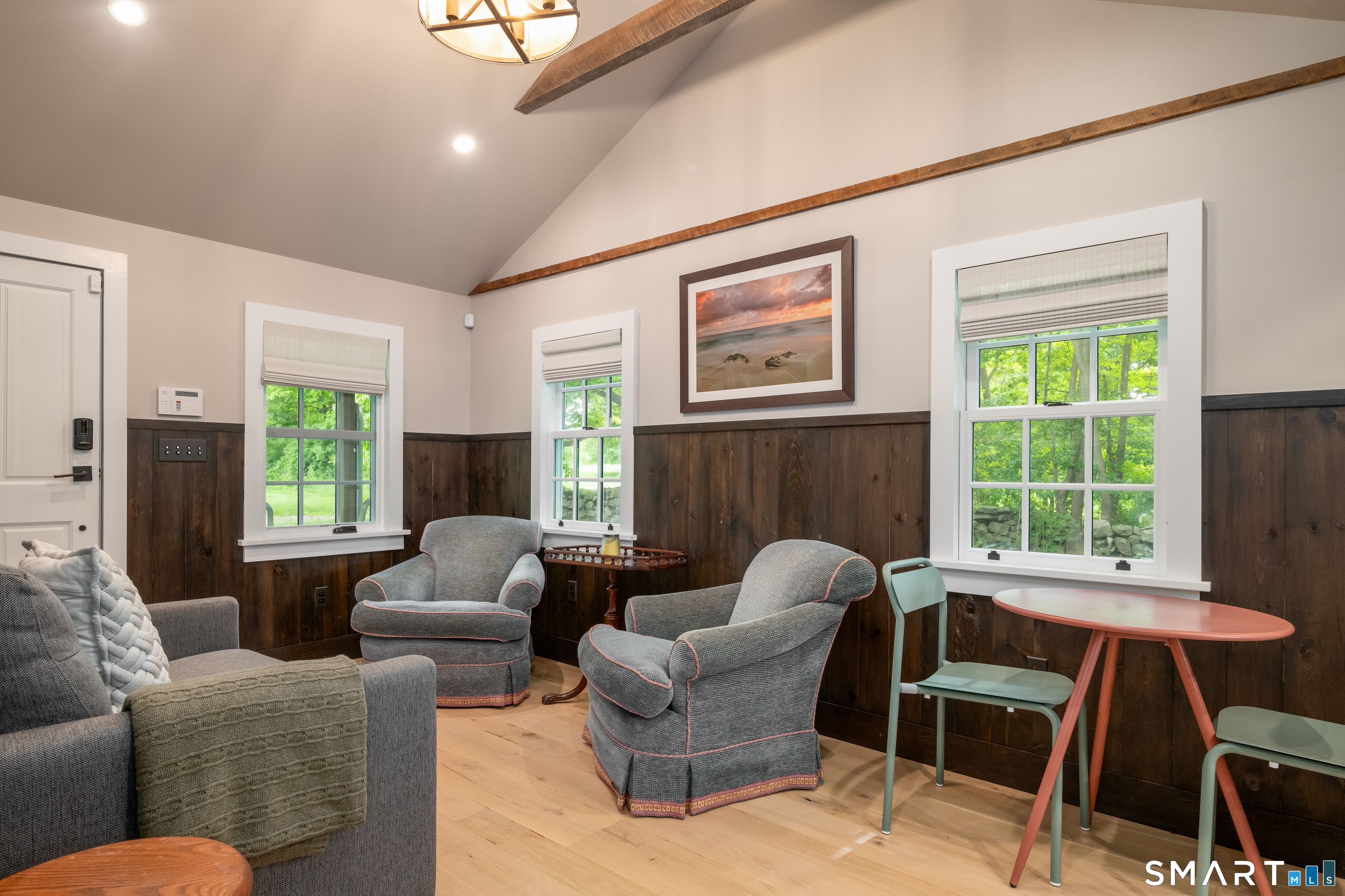 240 Umpawaug Road Redding, CT 06896 - Photo 27 of 40 The main living area of the cottage. Vaulted ceiling, beams, and dining area. So cozy and welcoming.