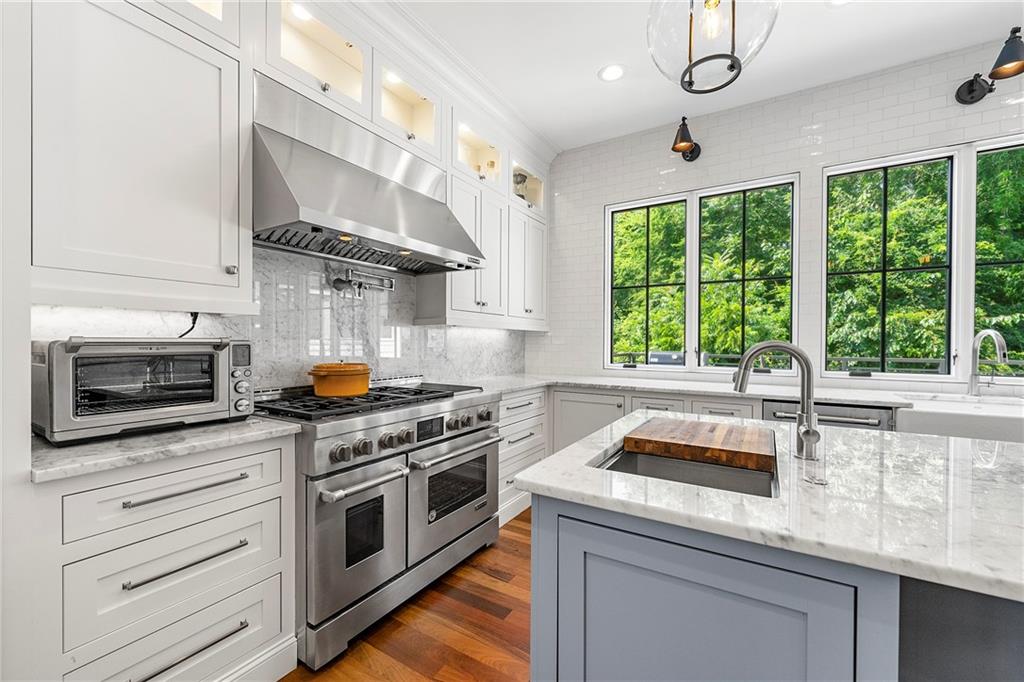 612 Fortune Place Northeast Atlanta, GA 30312 - Photo 17 of 48 a kitchen with a stove and a sink