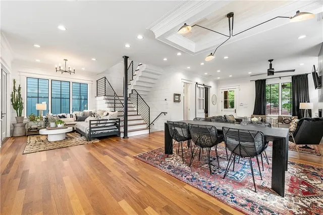 a living room with lots of furniture and a large window
