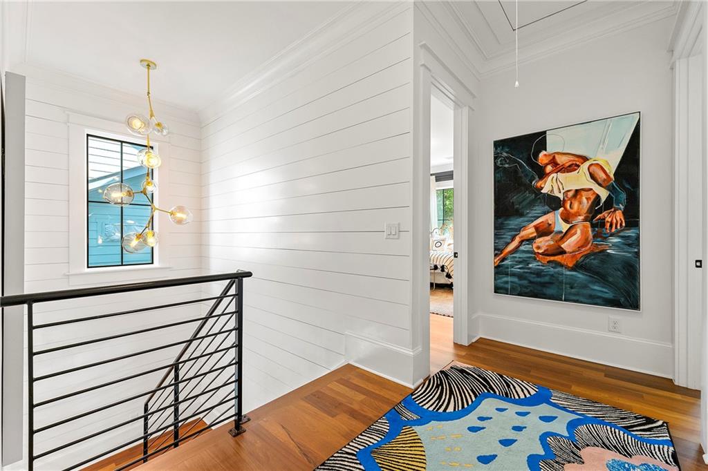 612 Fortune Place Northeast Atlanta, GA 30312 - Photo 21 of 48 a bedroom with a bed and a painting on the wall