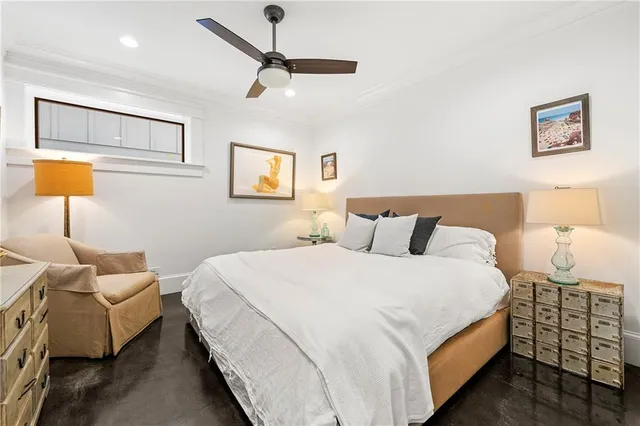 a bedroom with bed and window