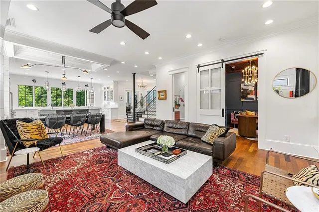 a living room with furniture and a rug