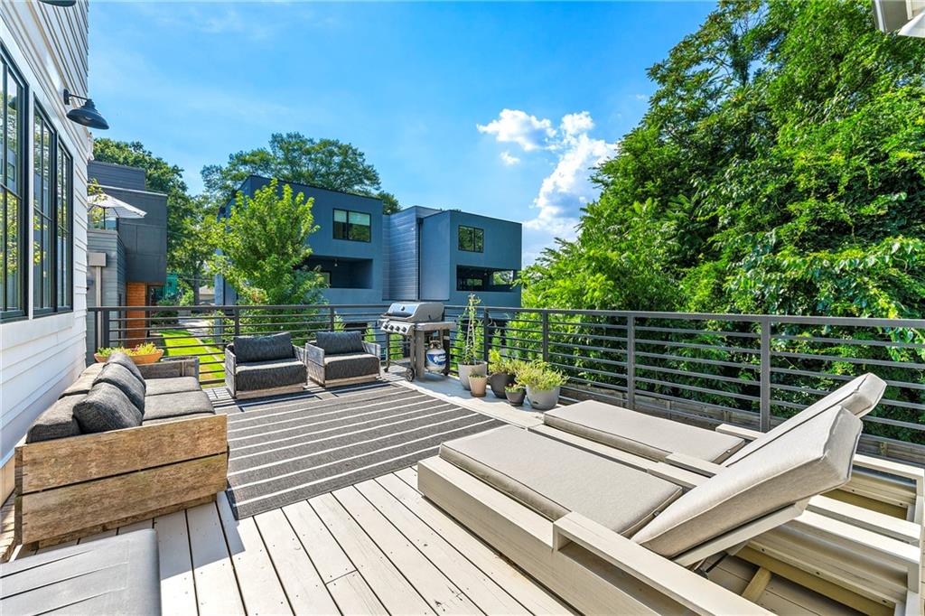 612 Fortune Place Northeast Atlanta, GA 30312 - Photo 44 of 48 a view of a roof deck with couches and potted plants