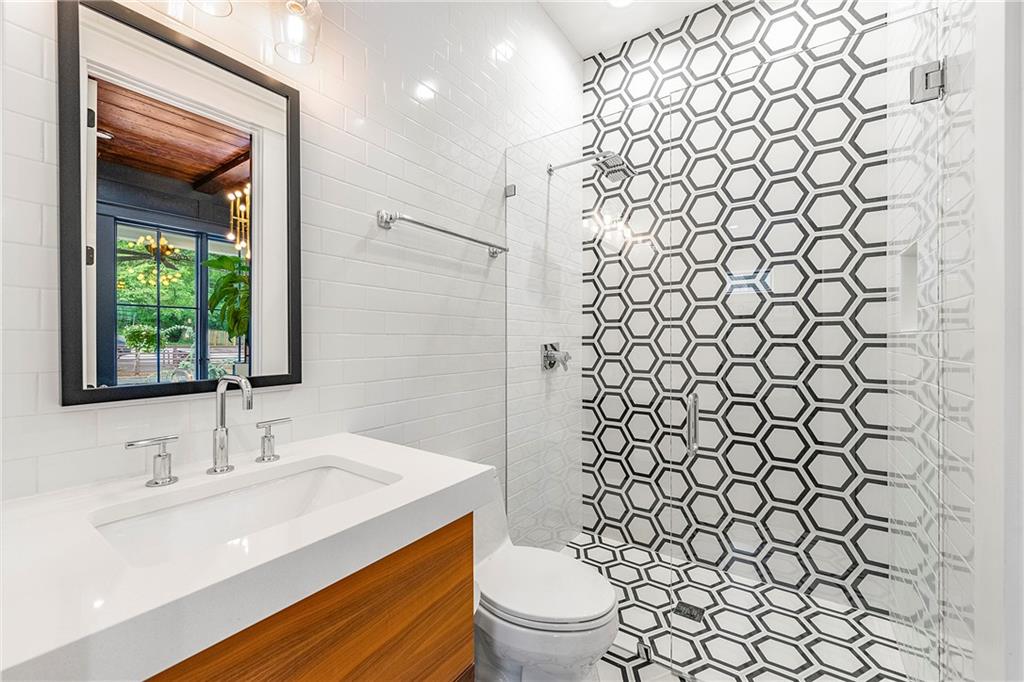 612 Fortune Place Northeast Atlanta, GA 30312 - Photo 8 of 48 a bathroom with a sink and a toilet