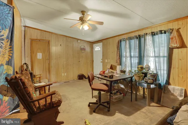 a view of a dining room with furniture and window