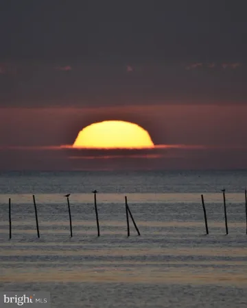a view of ocean and sunset