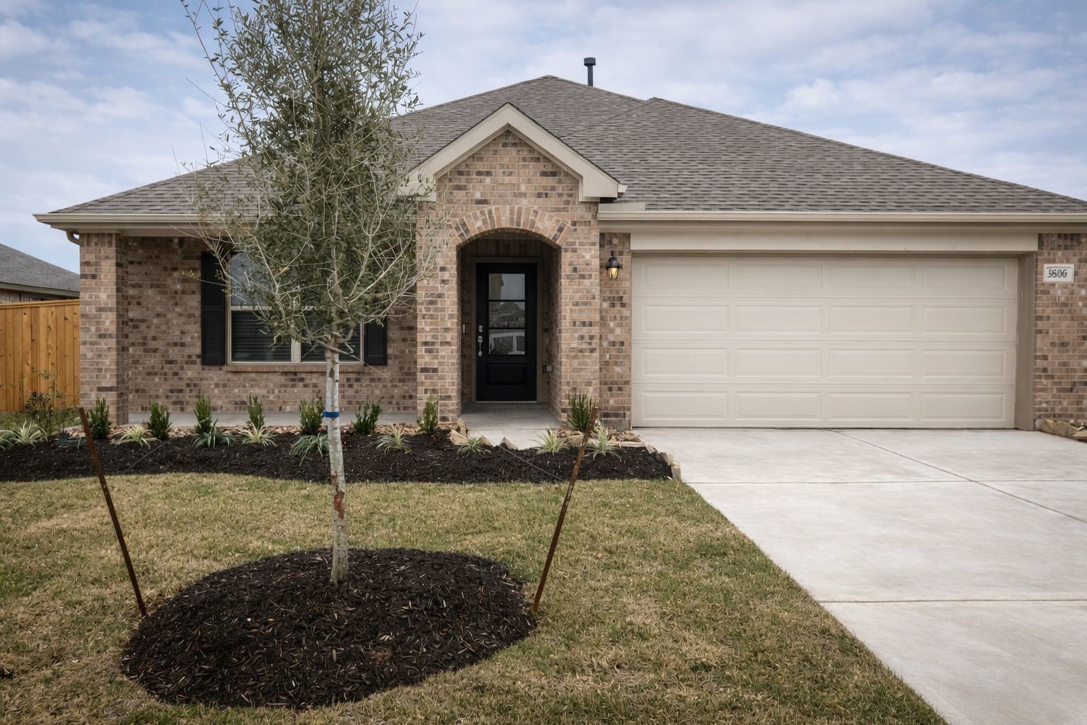 Beautiful curb appeal with a well-maintained lawn, modern elevation, and inviting entryway.