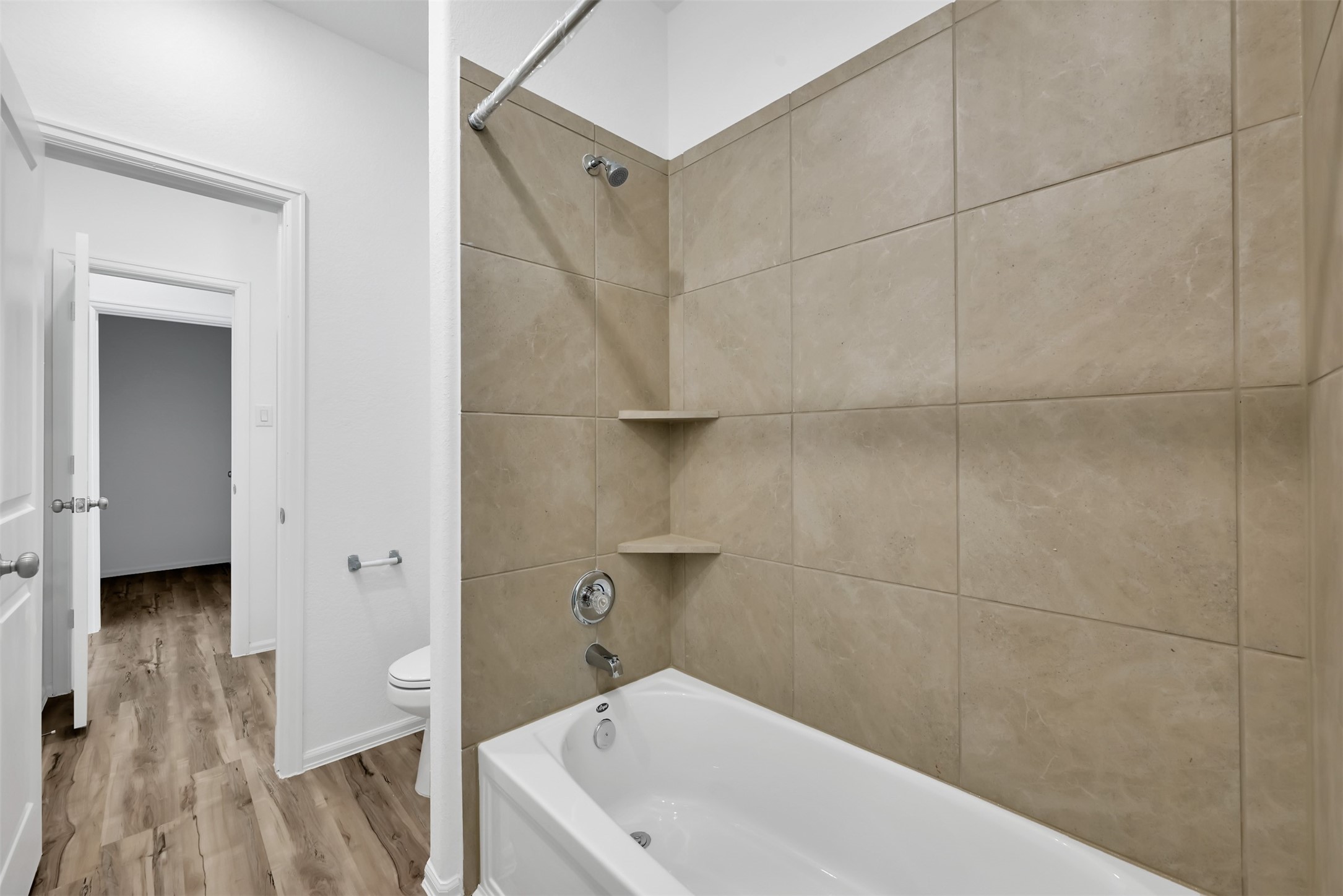 3806 Rock Ledge Drive Rosenberg, TX 77469 - Photo 12 of 23 Bathroom with tiled shower/tub combo and contemporary design.