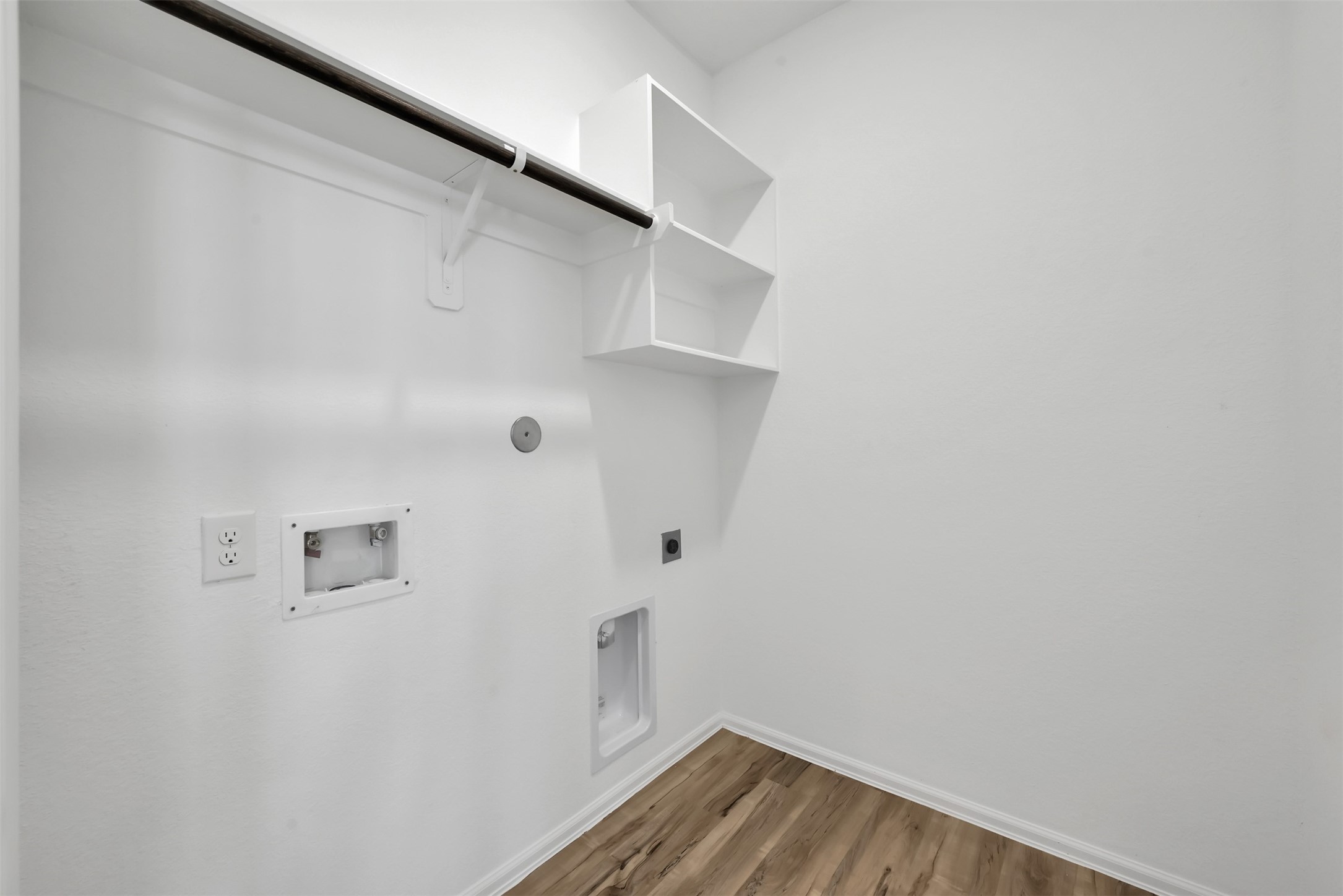 3806 Rock Ledge Drive Rosenberg, TX 77469 - Photo 14 of 23 Dedicated laundry room with built-in shelving for storage and convenience.