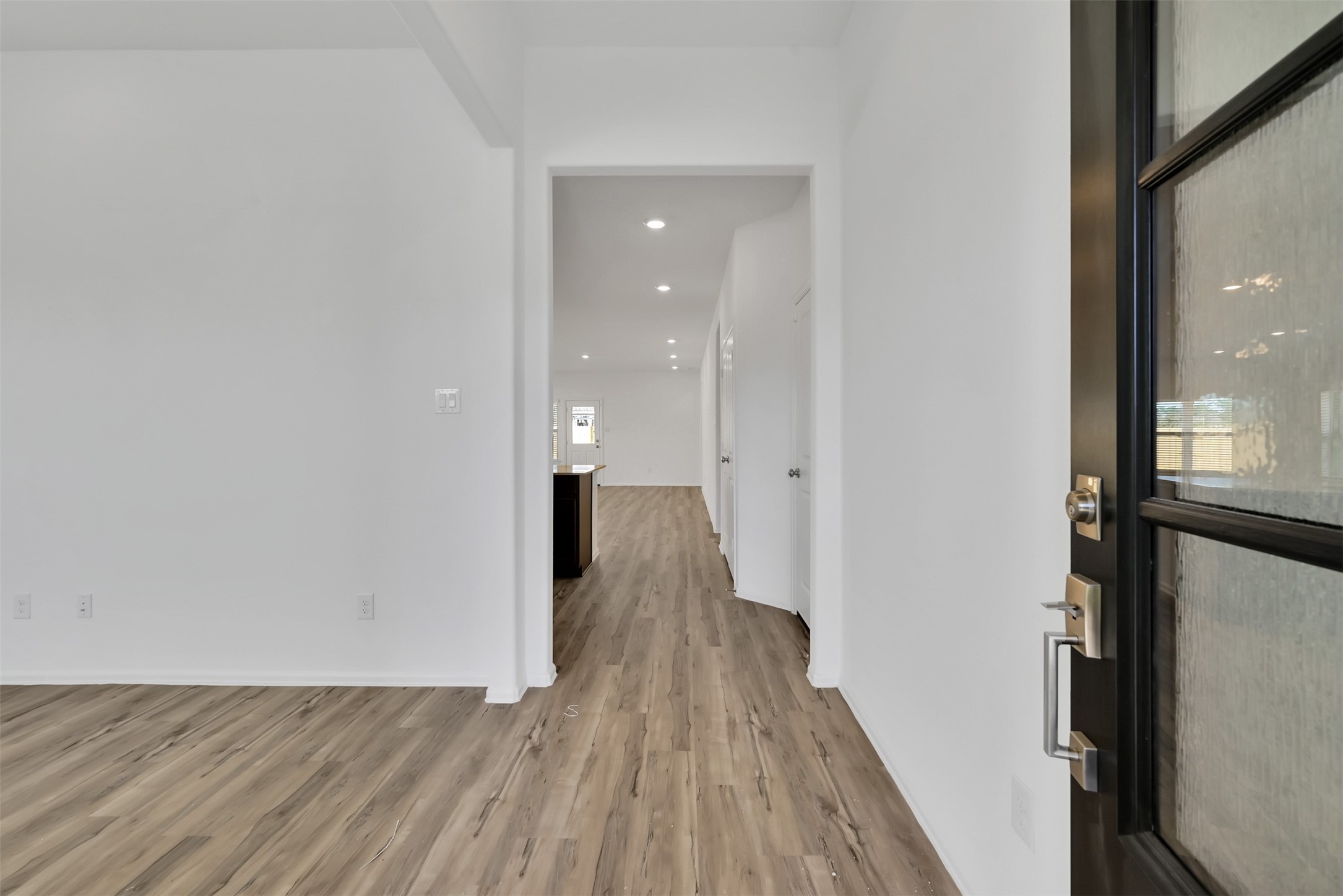 3806 Rock Ledge Drive Rosenberg, TX 77469 - Photo 20 of 23 Bright entry hallway with sleek flooring leading into the main living areas.