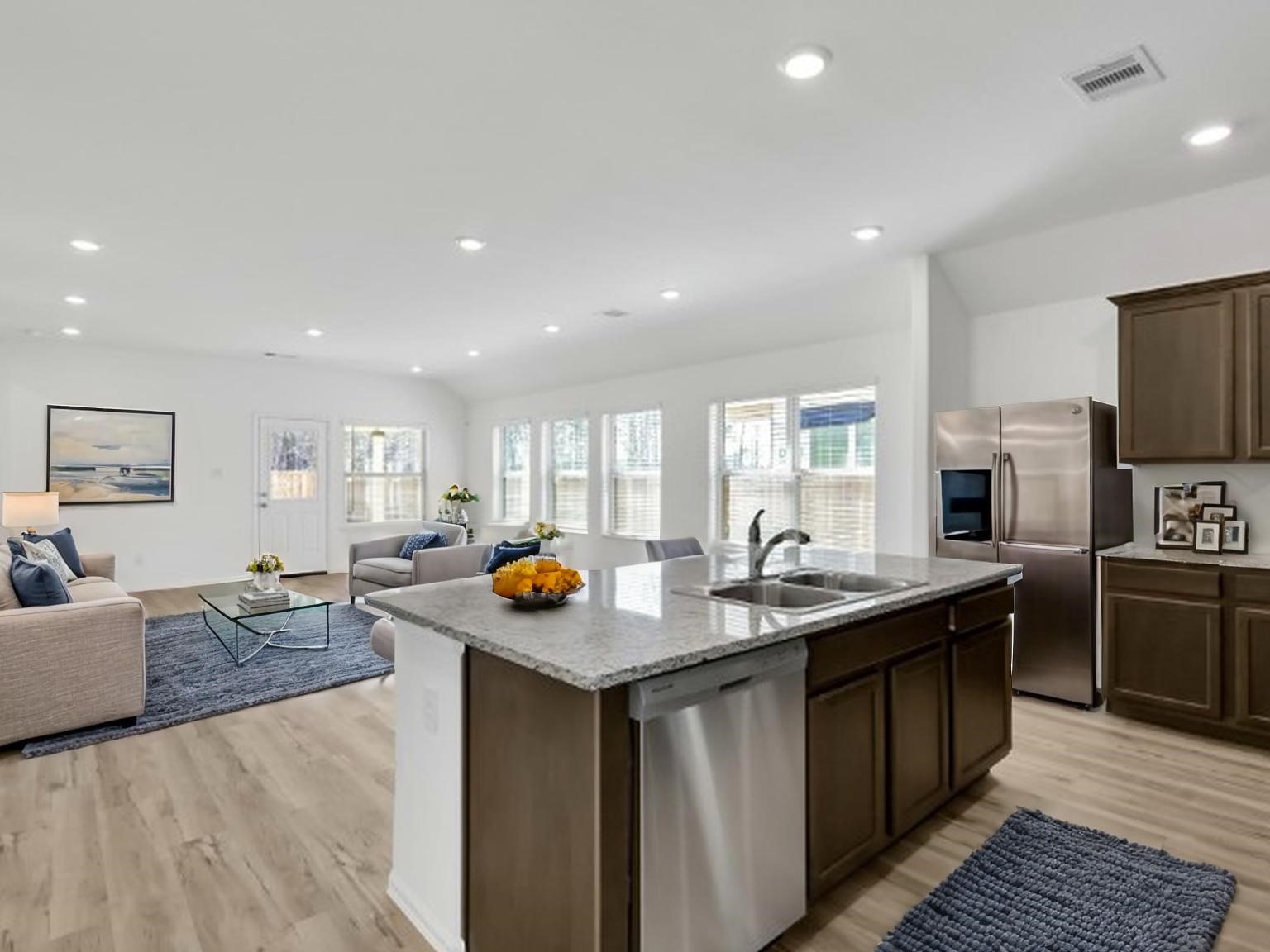 3806 Rock Ledge Drive Rosenberg, TX 77469 - Photo 4 of 23 Modern kitchen featuring an island, ample cabinetry, and open-concept design.