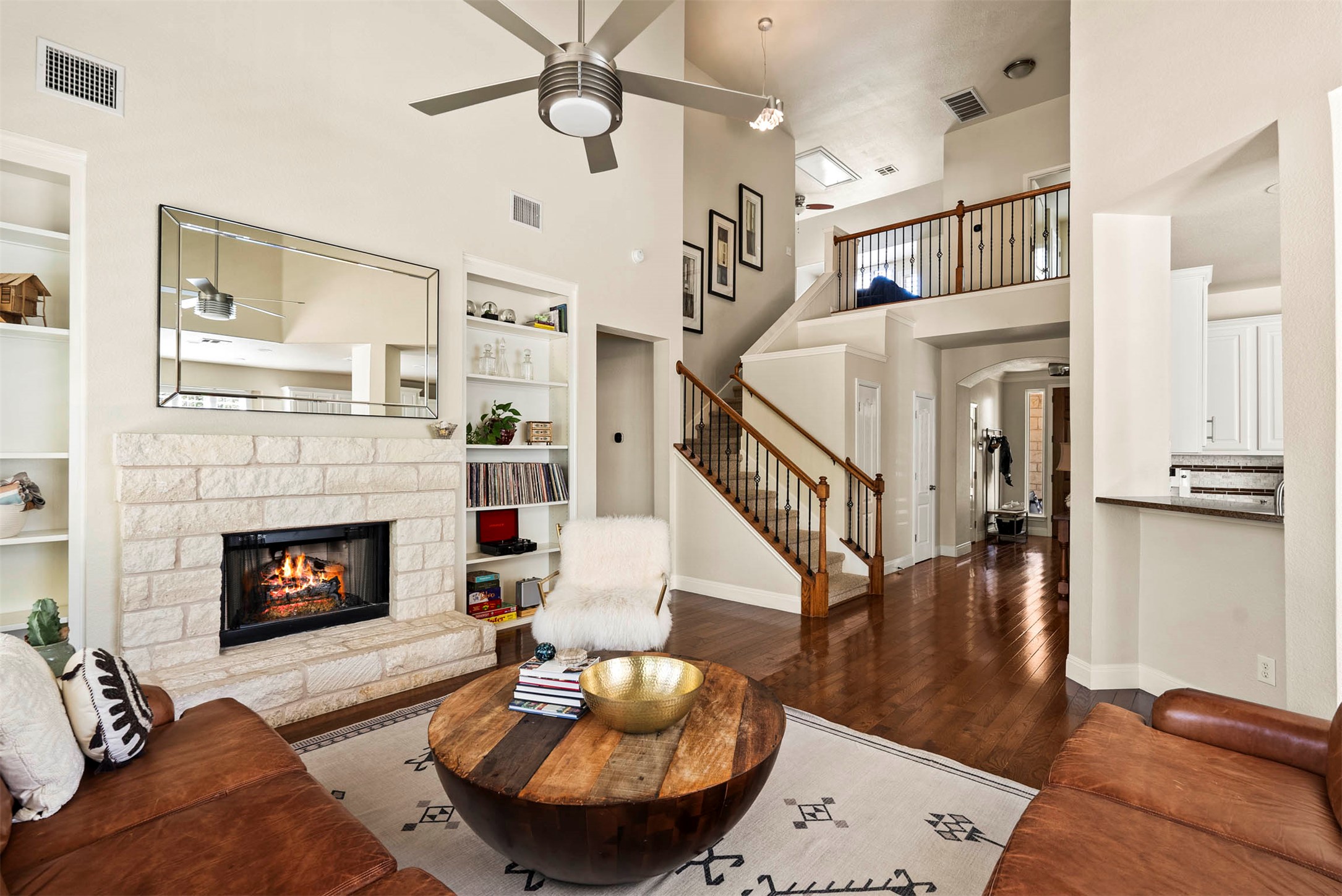 6720 Hansa Loop Austin, TX 78739 - Photo 15 of 38 Built-in bookshelves on both sides of the fireplace offer a perfect spot for displaying favorites and personal decor