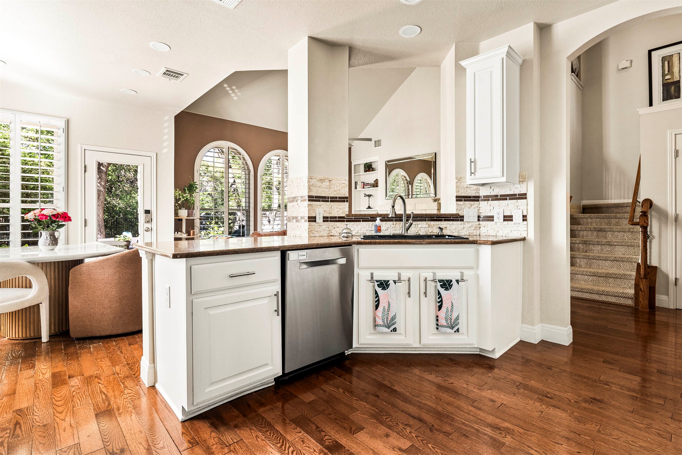 6720 Hansa Loop Austin, TX 78739 - Photo 16 of 38 The breakfast bar provides a natural spot for morning coffee or casual conversation while cooking