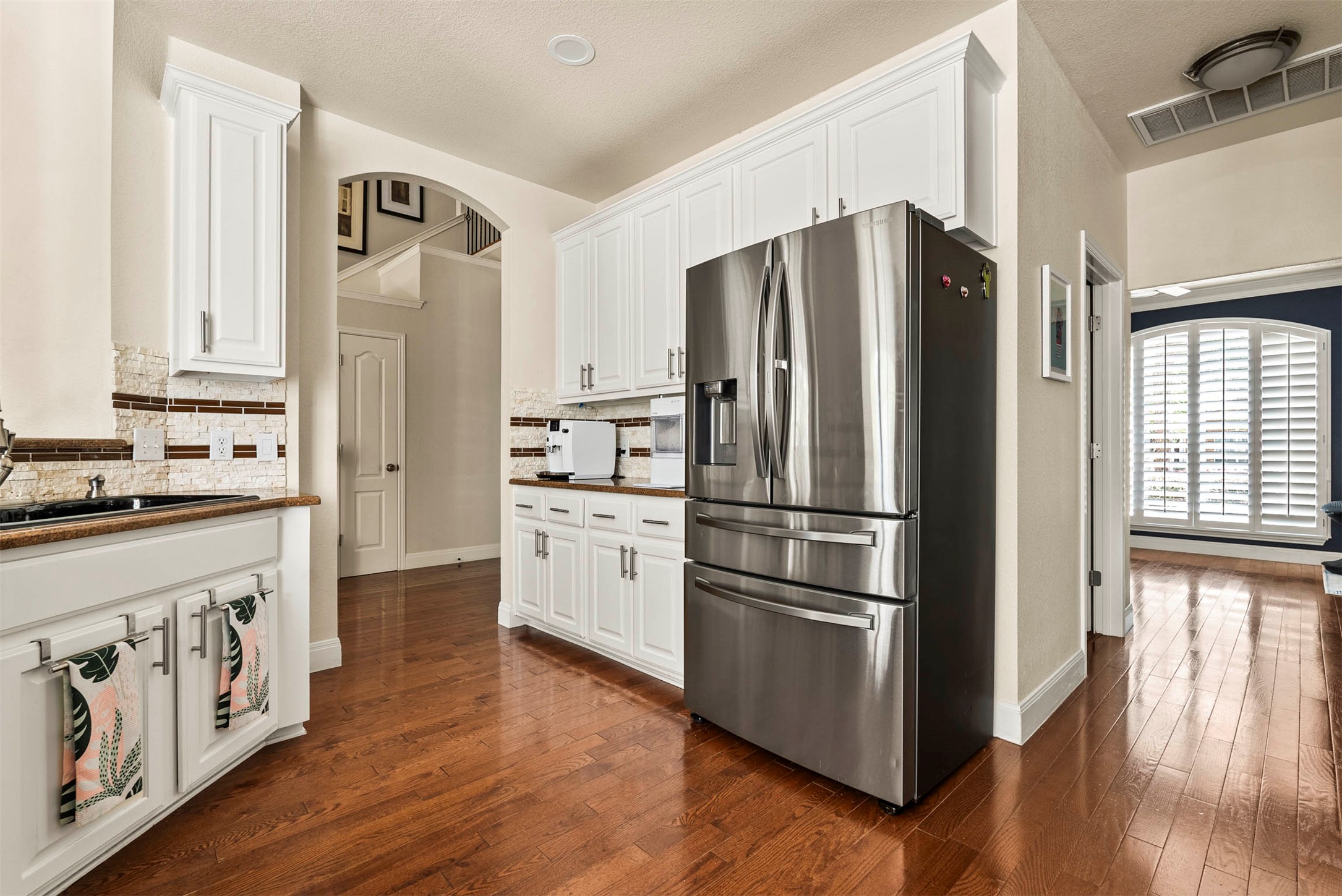 6720 Hansa Loop Austin, TX 78739 - Photo 18 of 38 Abundant cabinetry and a thoughtful layout ensure everything has its place in this high-traffic area