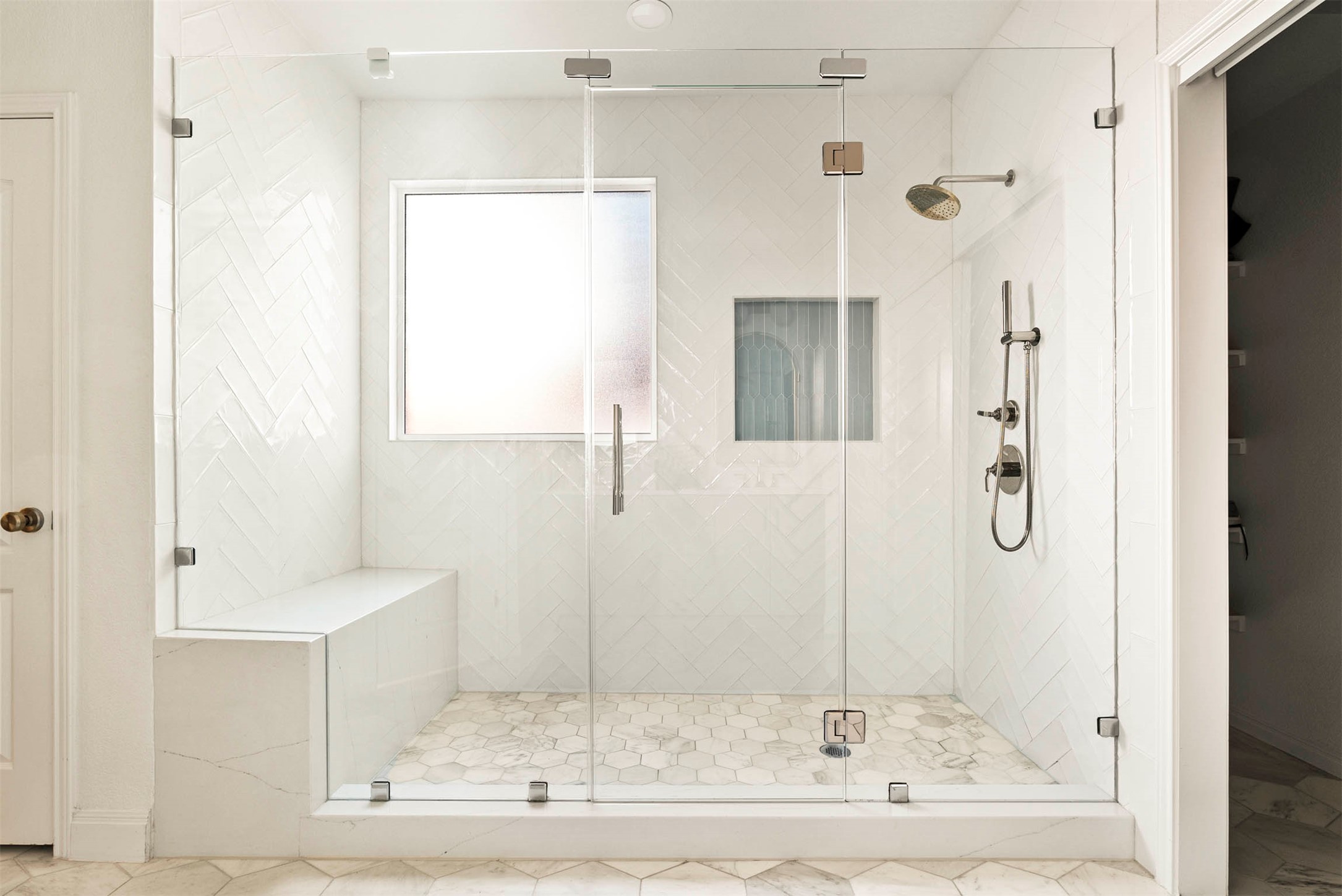 6720 Hansa Loop Austin, TX 78739 - Photo 23 of 38 An expansive walk-in shower features wrap-around tile work and a convenient bench seat