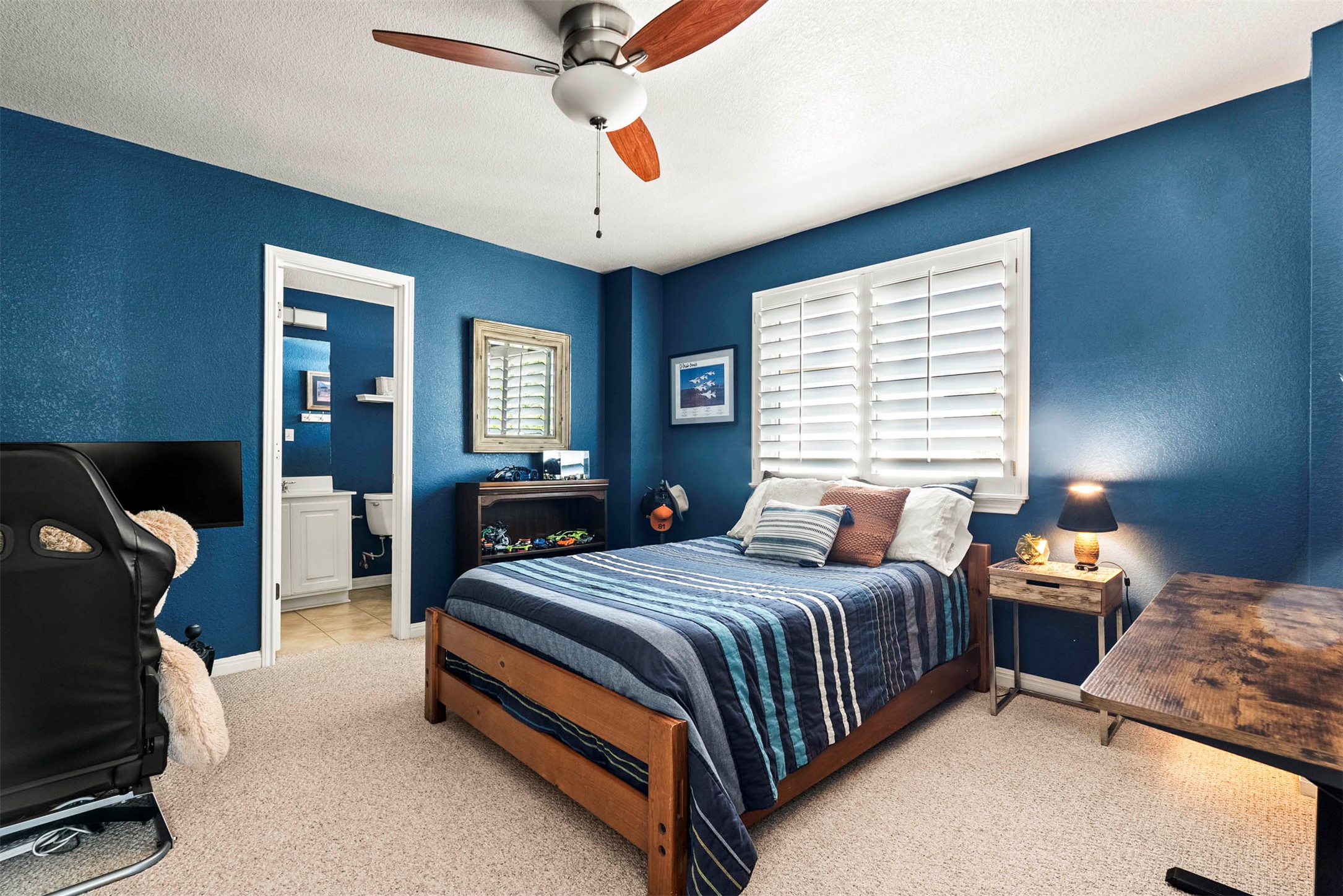 6720 Hansa Loop Austin, TX 78739 - Photo 29 of 38 One of the secondary bedrooms includes its own ensuite bath, making it ideal for long-term visitors.