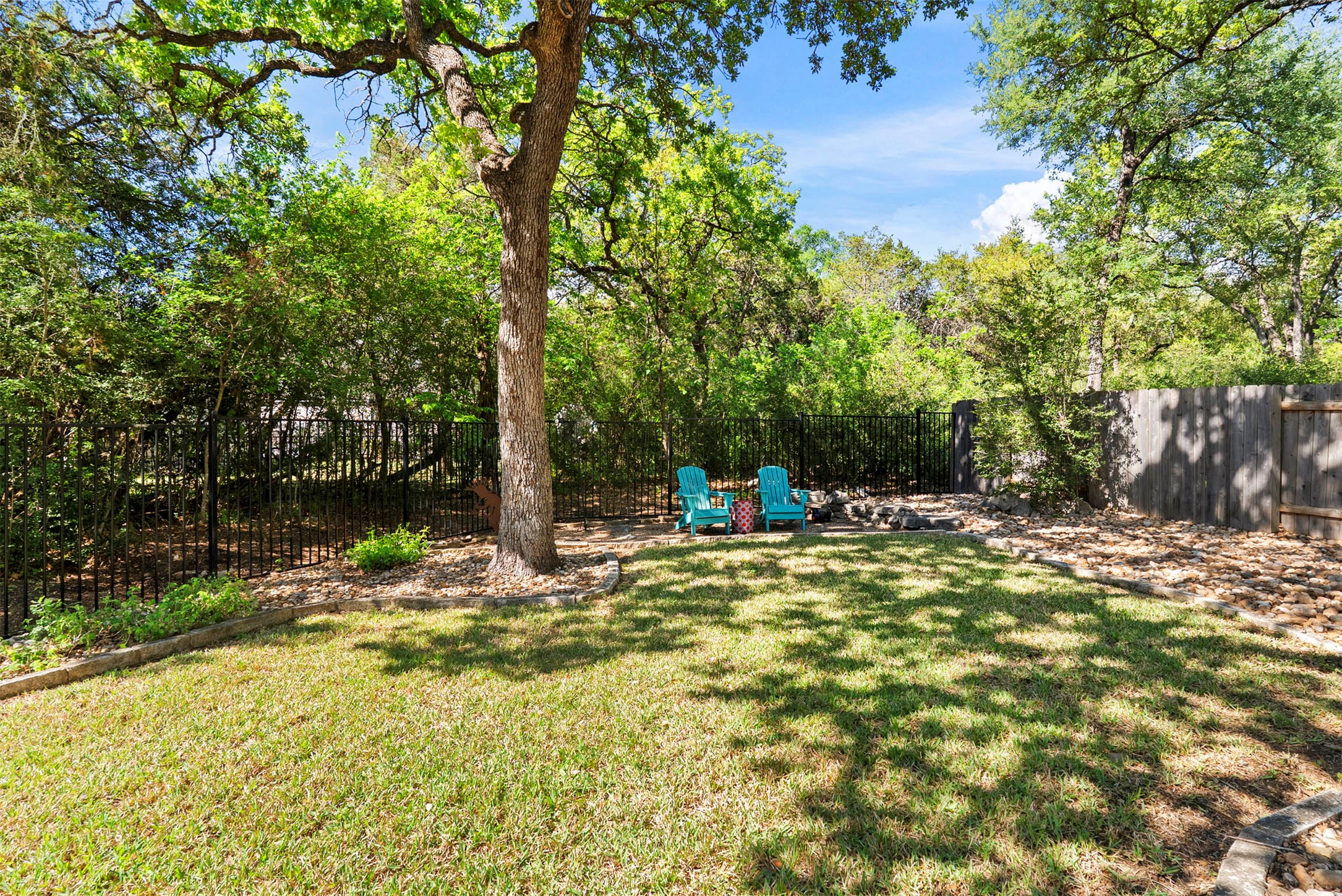6720 Hansa Loop Austin, TX 78739 - Photo 34 of 38 The park-like backyard is filled with huge trees that provide a natural canopy and a sense of seclusion