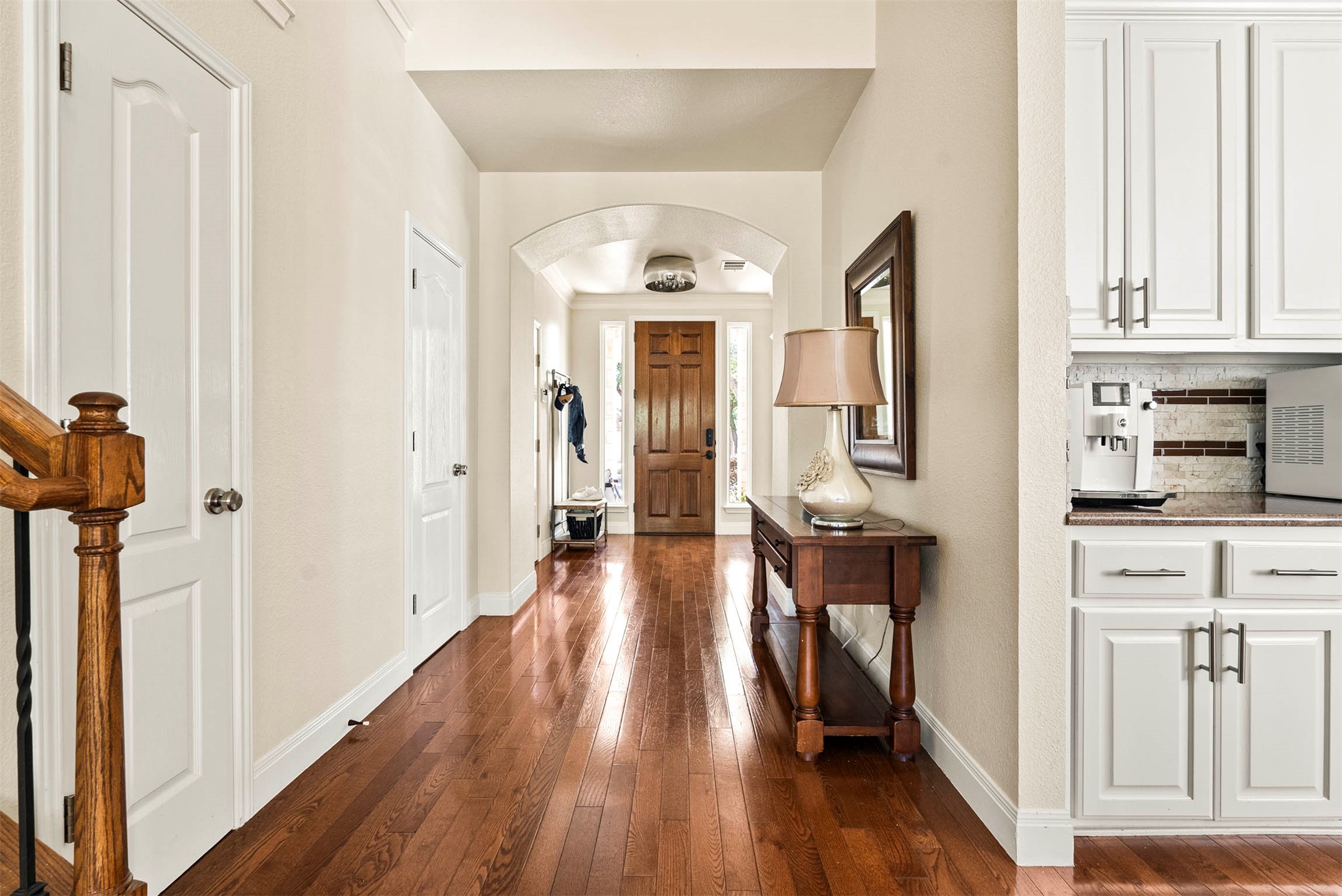 6720 Hansa Loop Austin, TX 78739 - Photo 10 of 38 The front door opens into a bright, welcoming entryway that immediately showcases the home's open layout