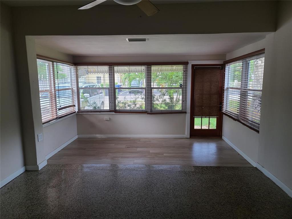 904 Southeast 13th Street Fort Lauderdale, FL 33316 - Photo 2 of 11 an empty room with wooden floor and windows