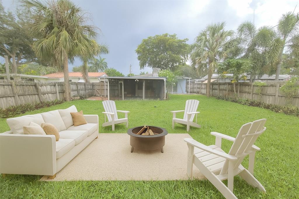 904 Southeast 13th Street Fort Lauderdale, FL 33316 - Photo 5 of 11 a view of a patio with couches chairs and a yard
