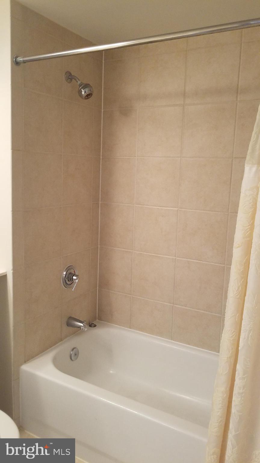 851 North Glebe Road, Unit 1015 Arlington, VA 22203 - Photo 12 of 29 a bathroom with a shower and a bath tub