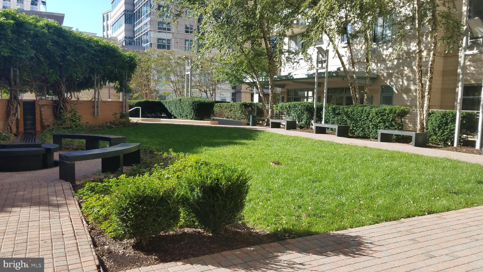 851 North Glebe Road, Unit 1015 Arlington, VA 22203 - Photo 2 of 29 a front view of a house with garden