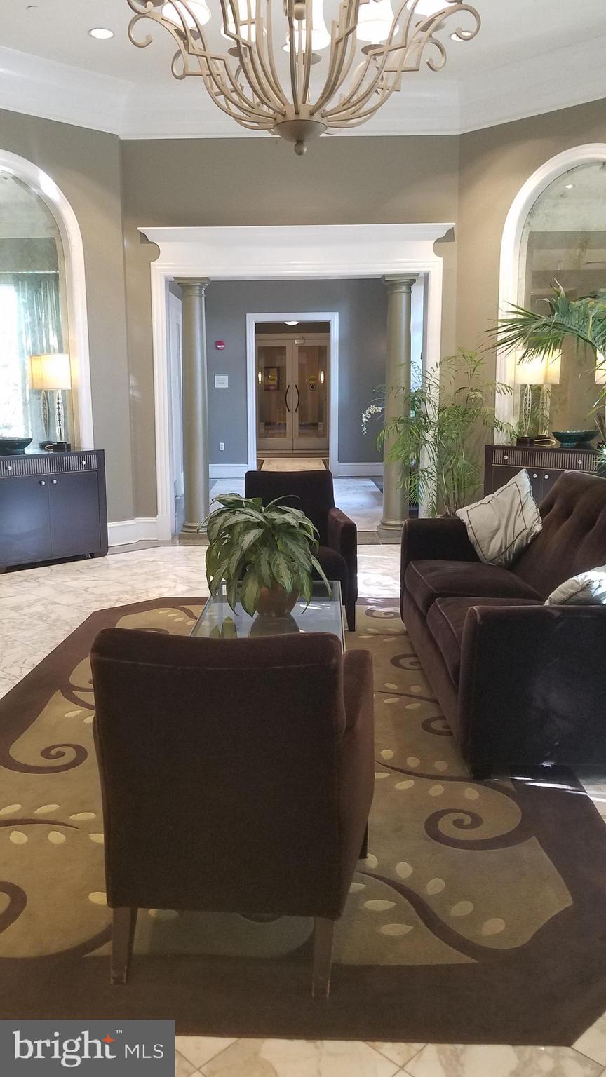 851 North Glebe Road, Unit 1015 Arlington, VA 22203 - Photo 21 of 29 a living room with furniture and a large window