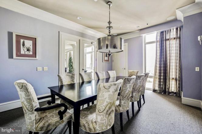 851 North Glebe Road, Unit 1015 Arlington, VA 22203 - Photo 28 of 29 a view of a dining room with furniture window and wooden floor