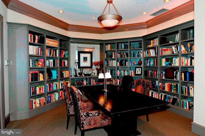 851 North Glebe Road, Unit 1015 Arlington, VA 22203 - Photo 29 of 29 a room with lots of furniture and a book shelf