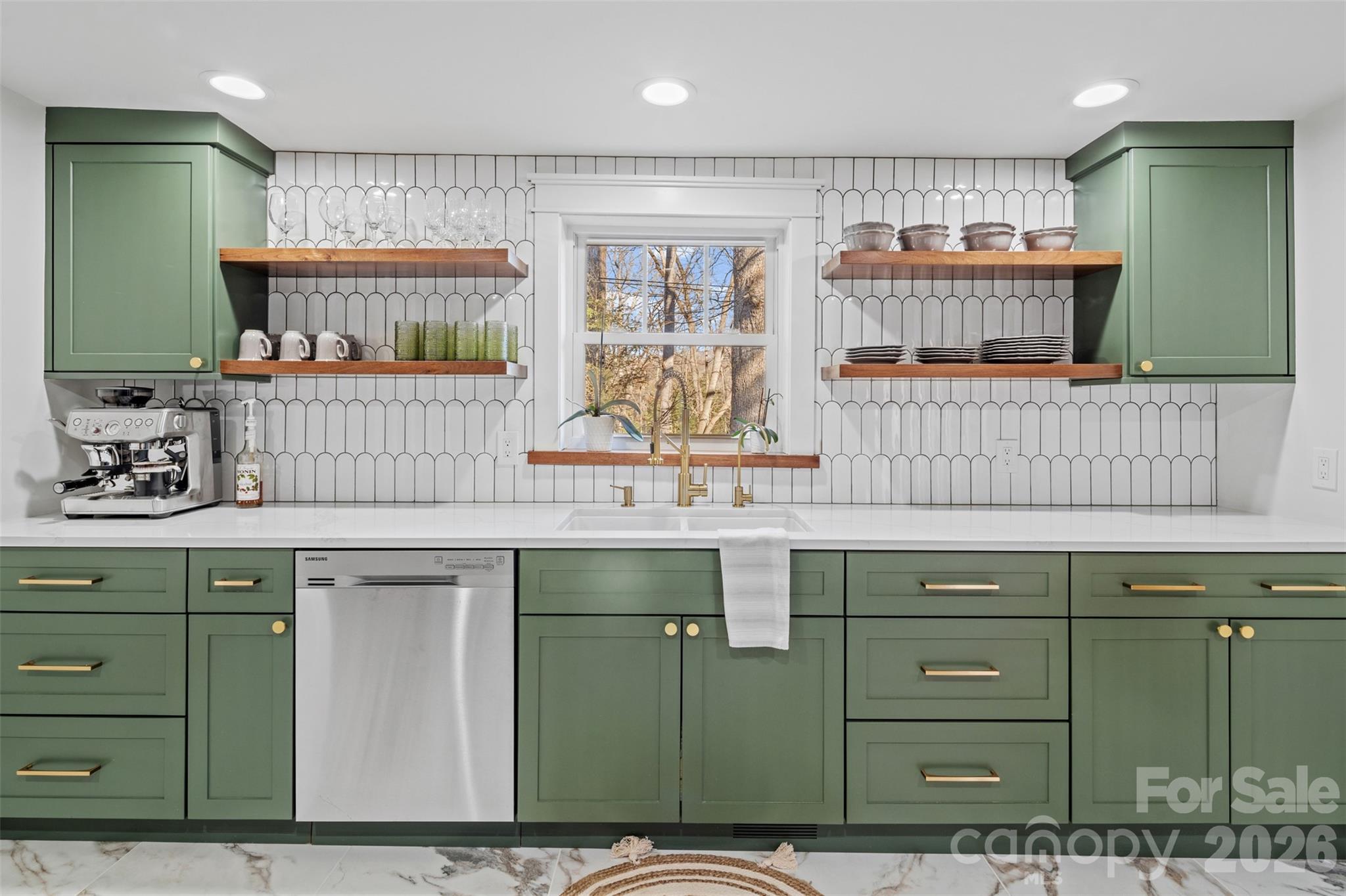 32 Youngs Cove Road Candler, NC 28715 - Photo 11 of 35 a kitchen with a sink and cabinets