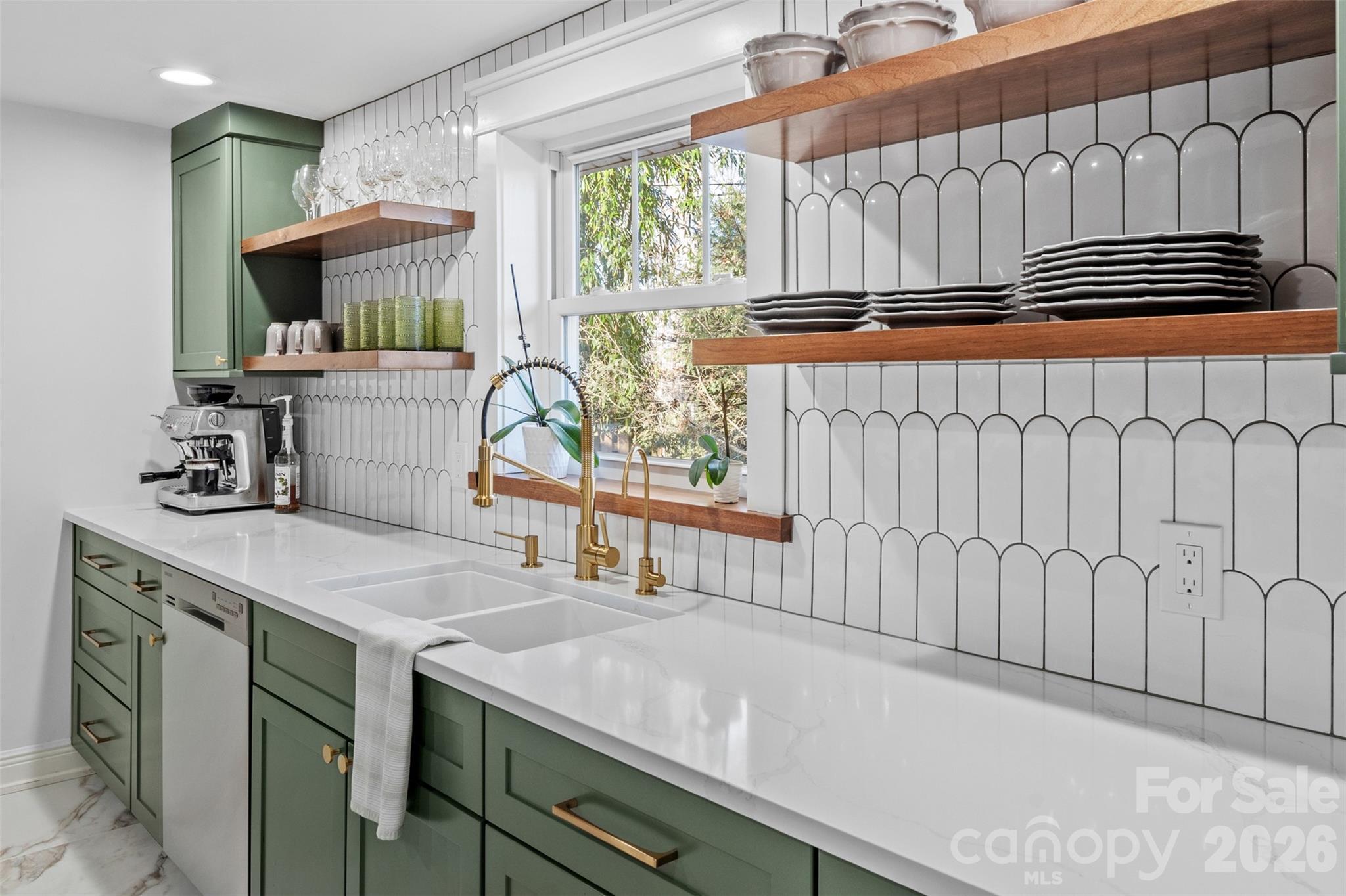 32 Youngs Cove Road Candler, NC 28715 - Photo 12 of 35 a kitchen with a sink and a stove top oven