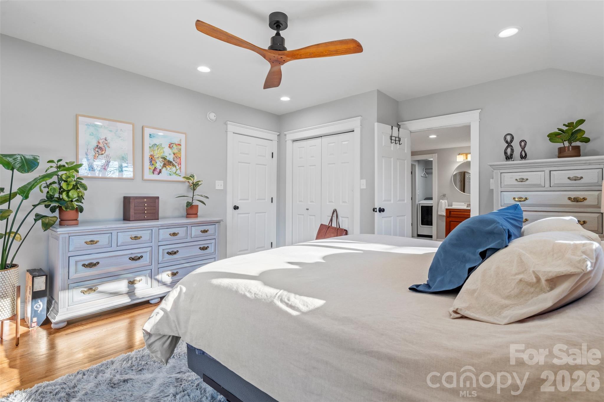 32 Youngs Cove Road Candler, NC 28715 - Photo 16 of 35 a bed room with a bed and a couch