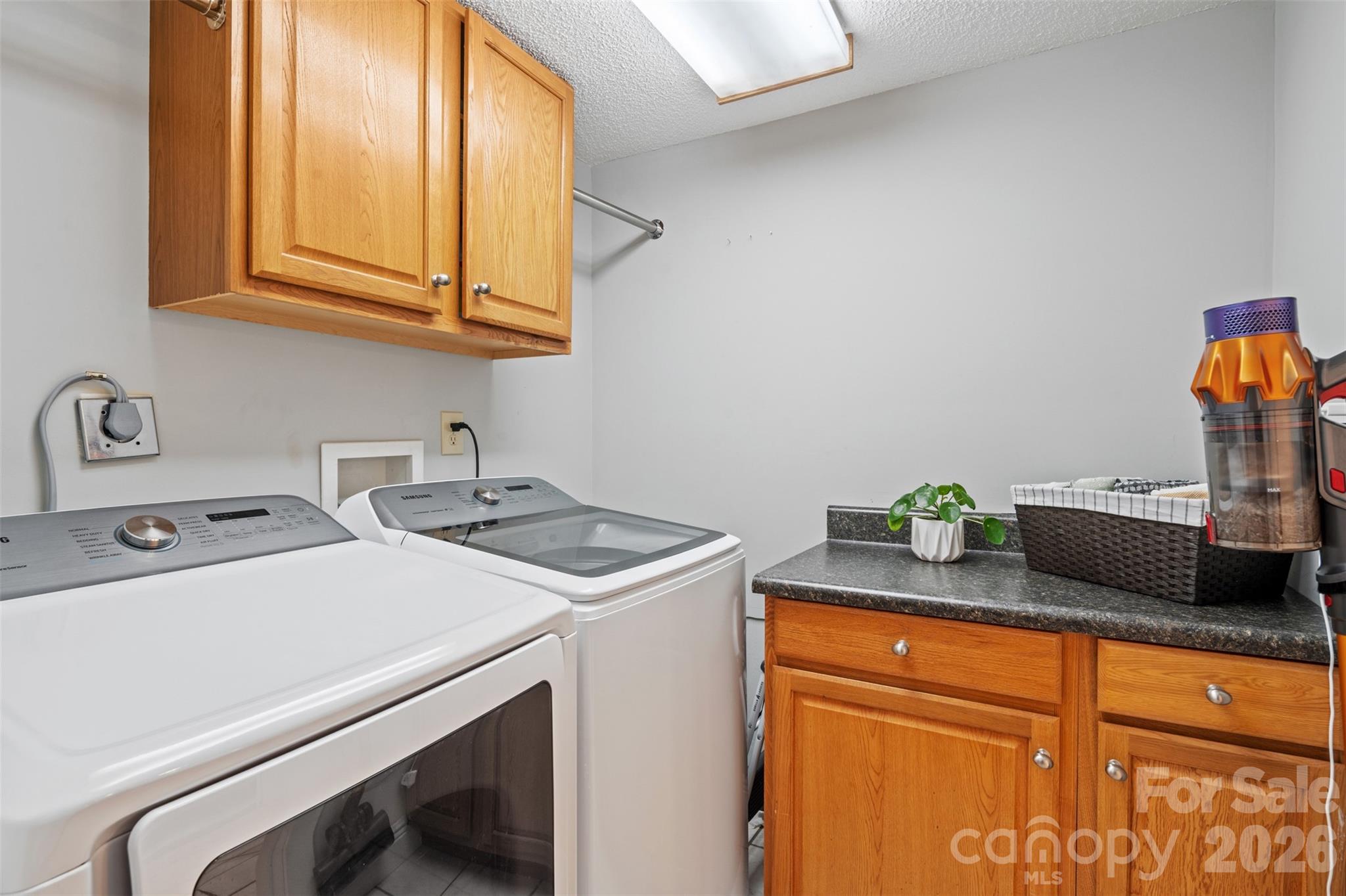 32 Youngs Cove Road Candler, NC 28715 - Photo 19 of 35 a utility room with dryer and washer