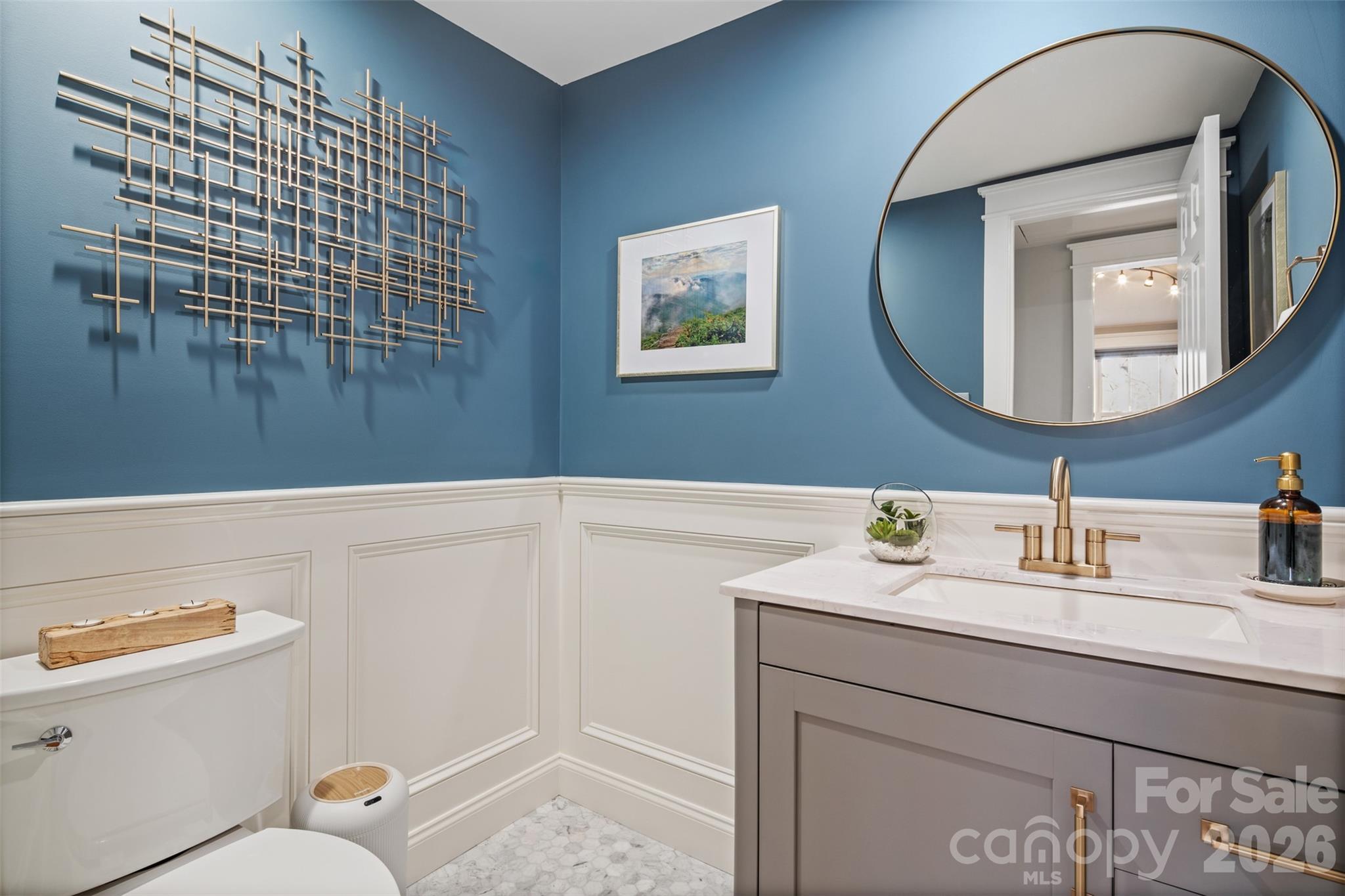 32 Youngs Cove Road Candler, NC 28715 - Photo 20 of 35 a bathroom with a sink a mirror and a toilet