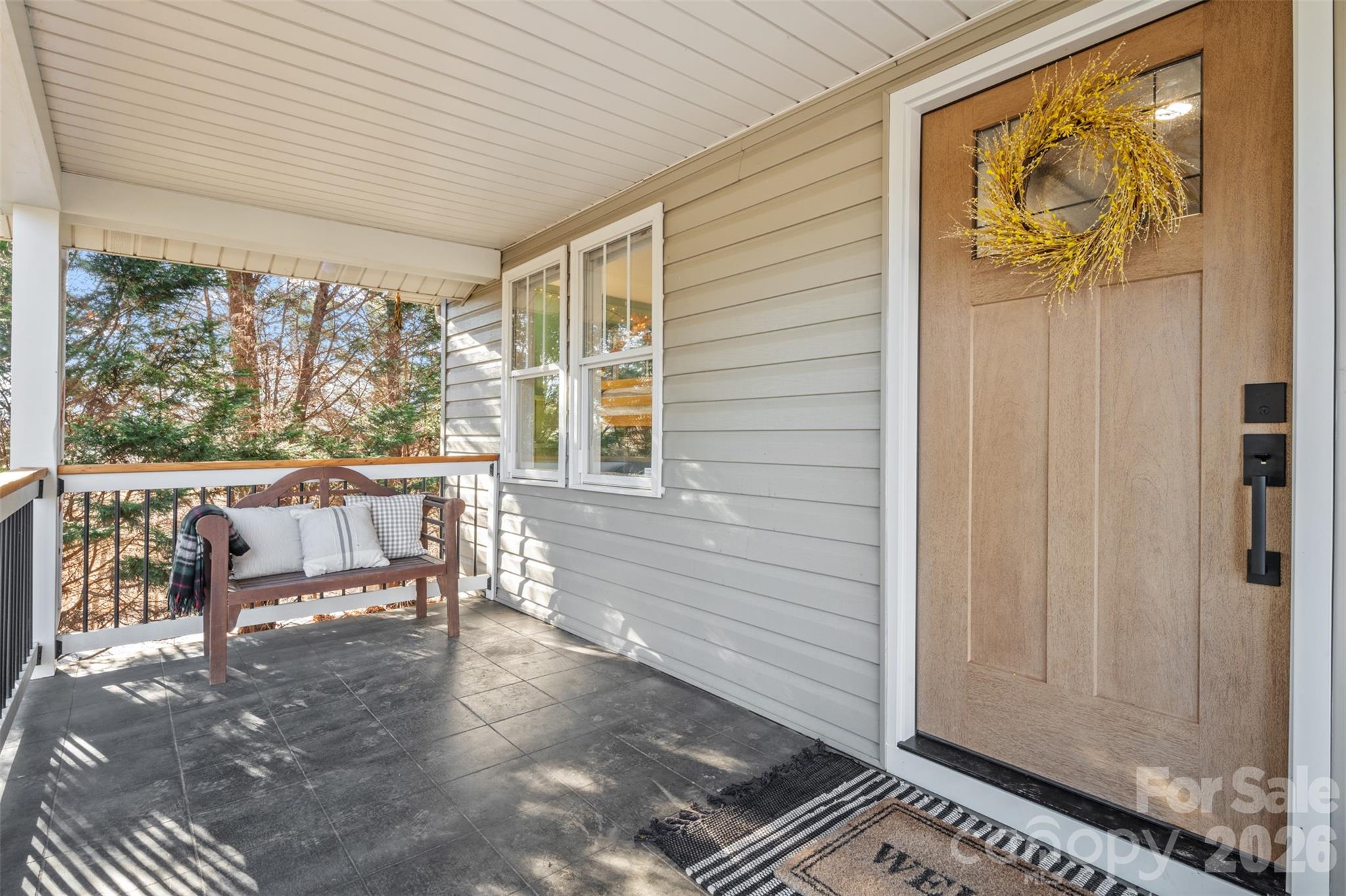 32 Youngs Cove Road Candler, NC 28715 - Photo 2 of 35 a balcony with chairs and table