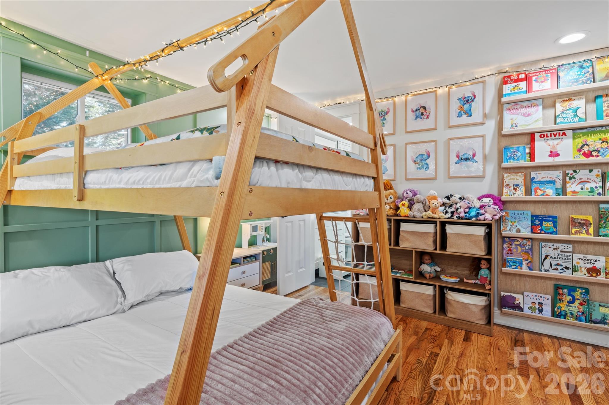 32 Youngs Cove Road Candler, NC 28715 - Photo 21 of 35 a living room with furniture a rug and a book shelf