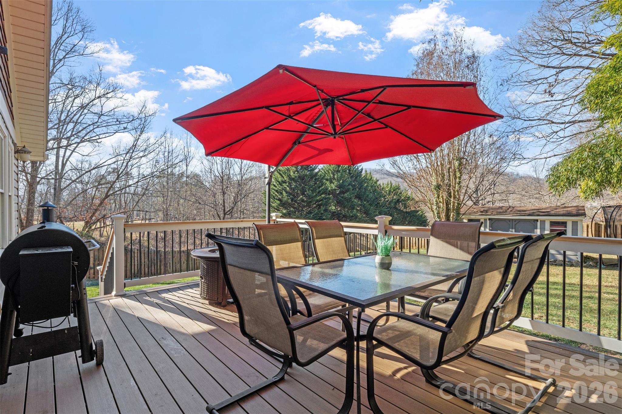 32 Youngs Cove Road Candler, NC 28715 - Photo 25 of 35 a view of balcony with outdoor seating and wooden floor
