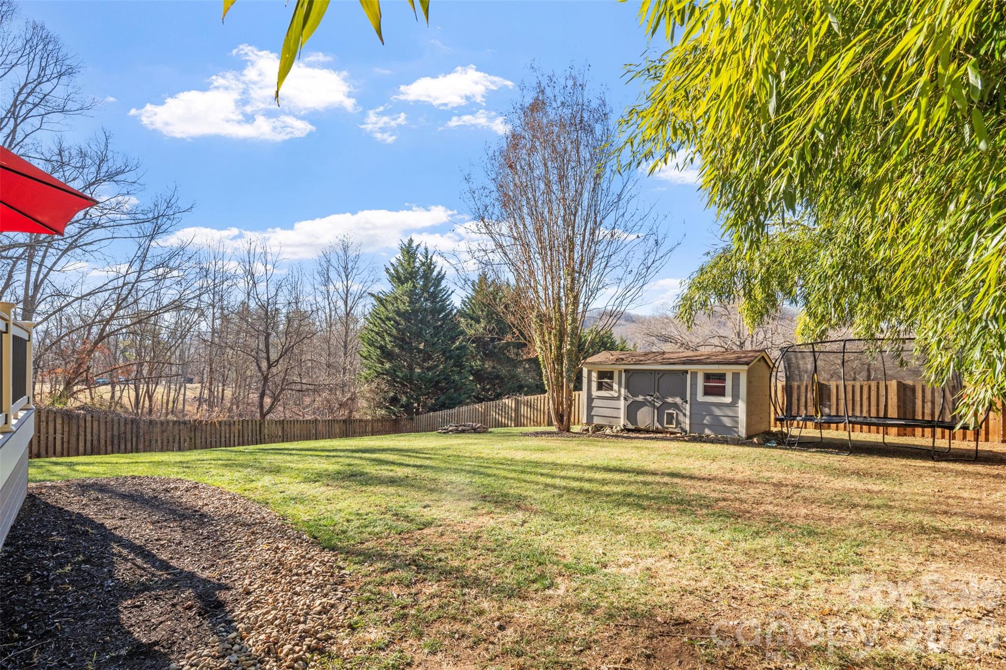 32 Youngs Cove Road Candler, NC 28715 - Photo 27 of 35 a view of a house with a yard