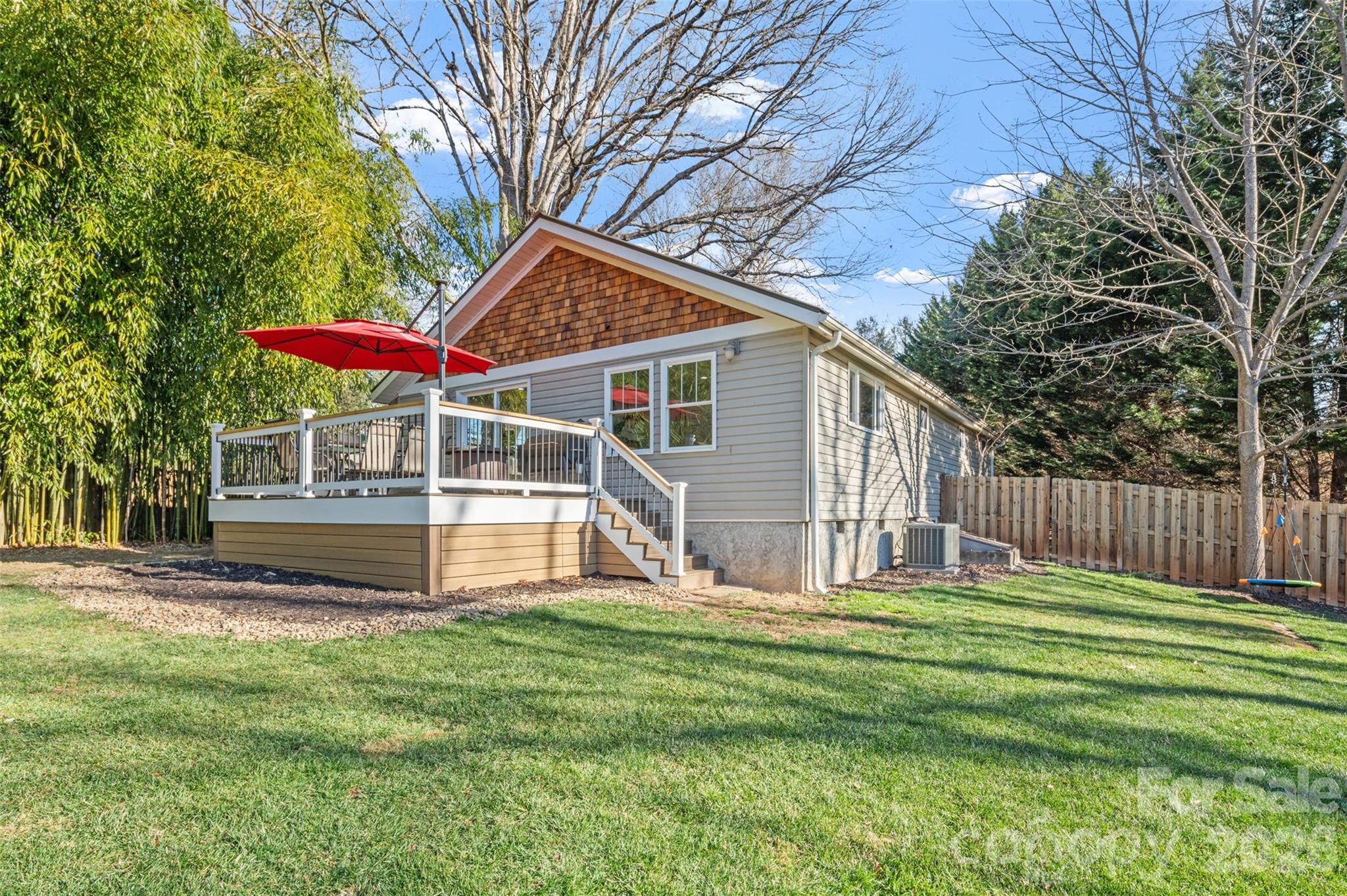 32 Youngs Cove Road Candler, NC 28715 - Photo 28 of 35 a view of a house with a yard and sitting area