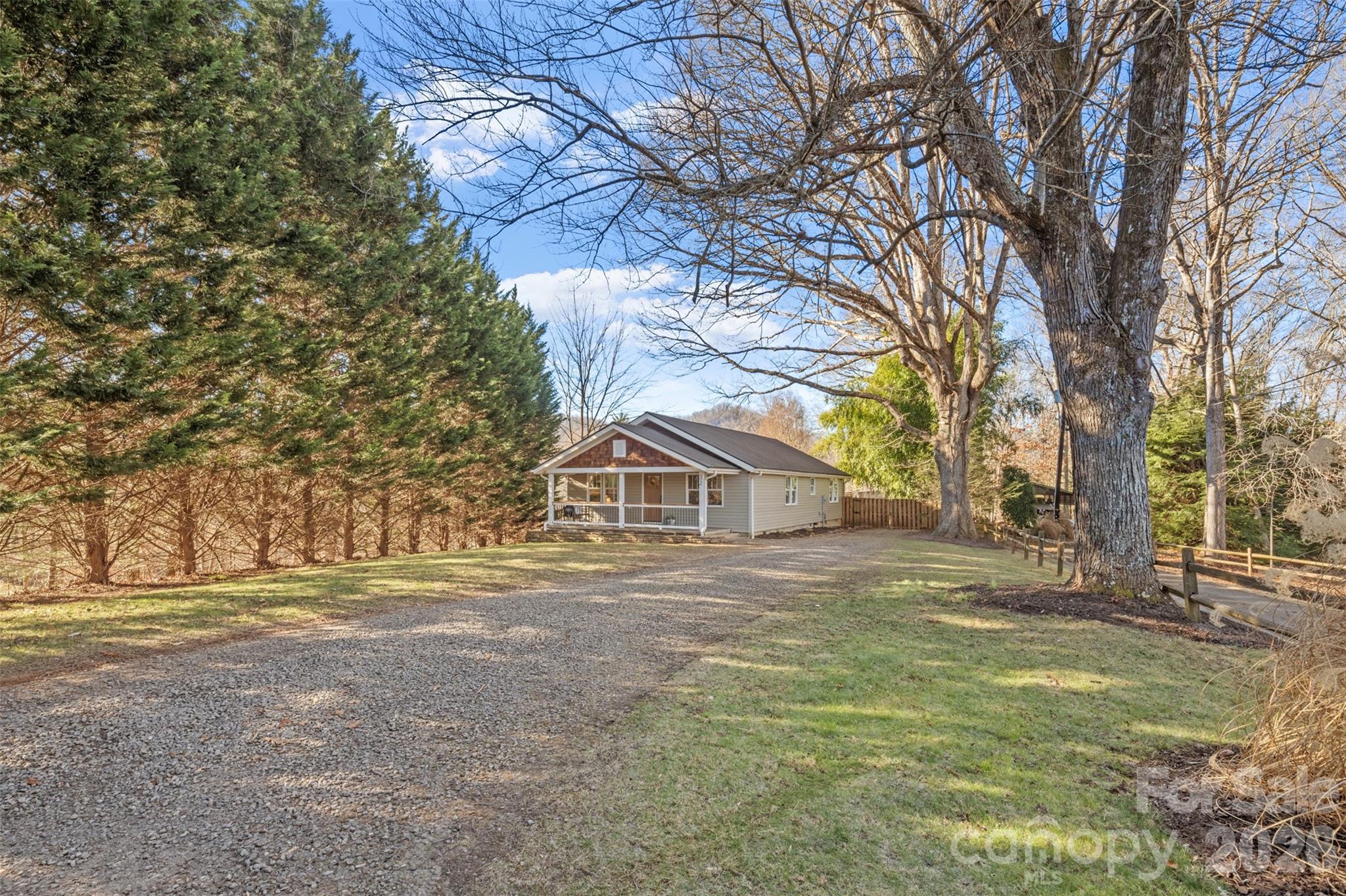 32 Youngs Cove Road Candler, NC 28715 - Photo 32 of 35 a front view of a house with a yard