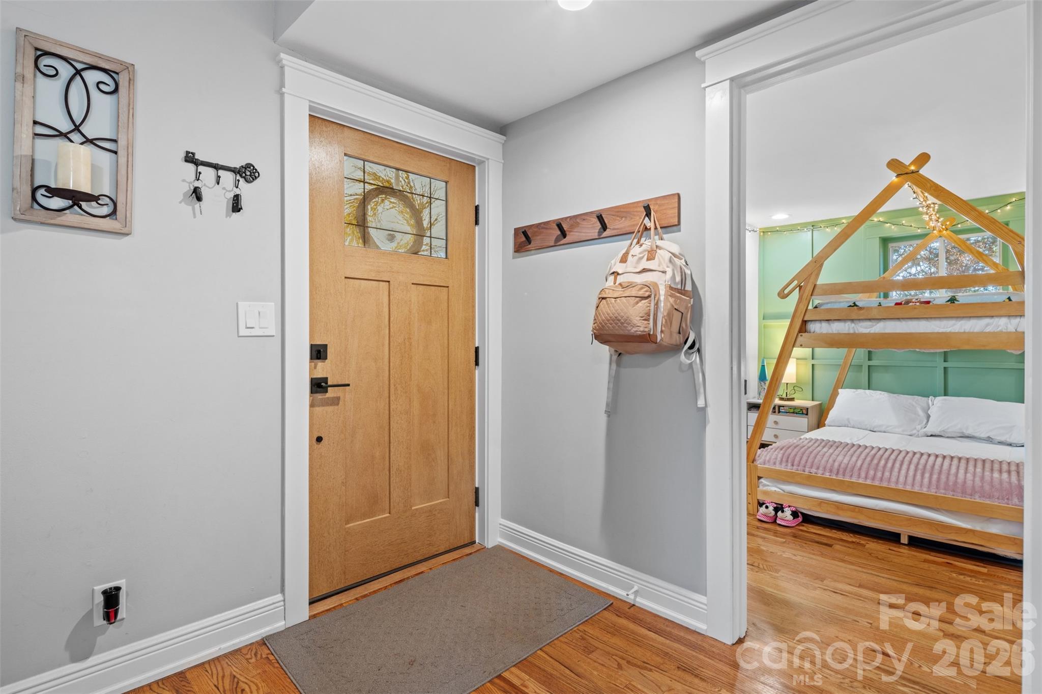 32 Youngs Cove Road Candler, NC 28715 - Photo 4 of 35 a view of a bedroom with baby crib and a window