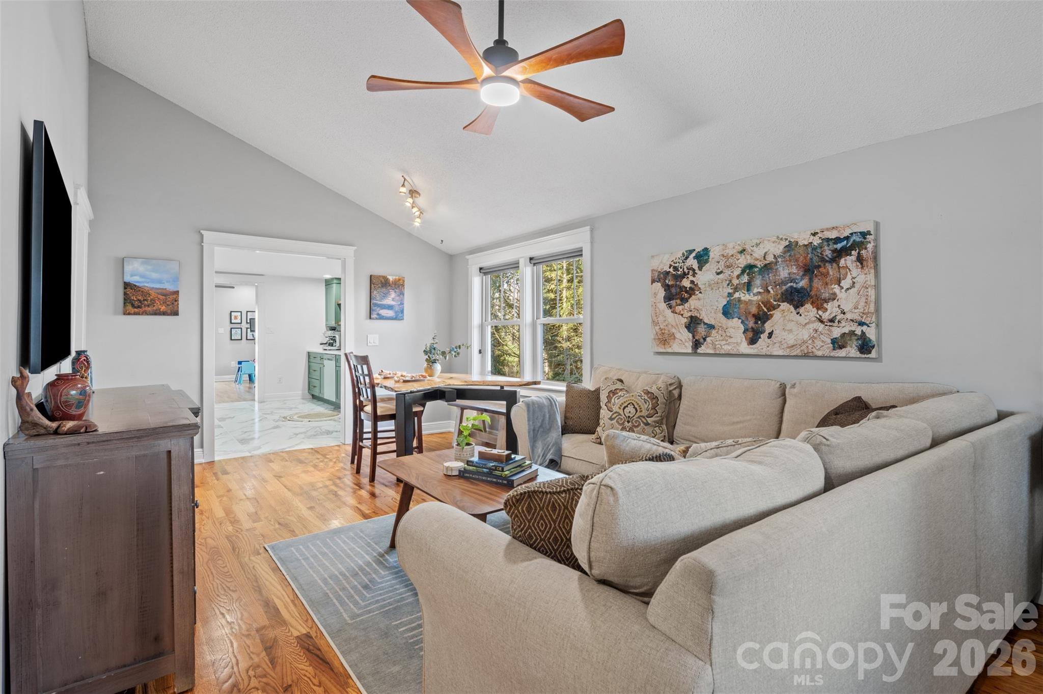 32 Youngs Cove Road Candler, NC 28715 - Photo 5 of 35 a living room with furniture and a flat screen tv