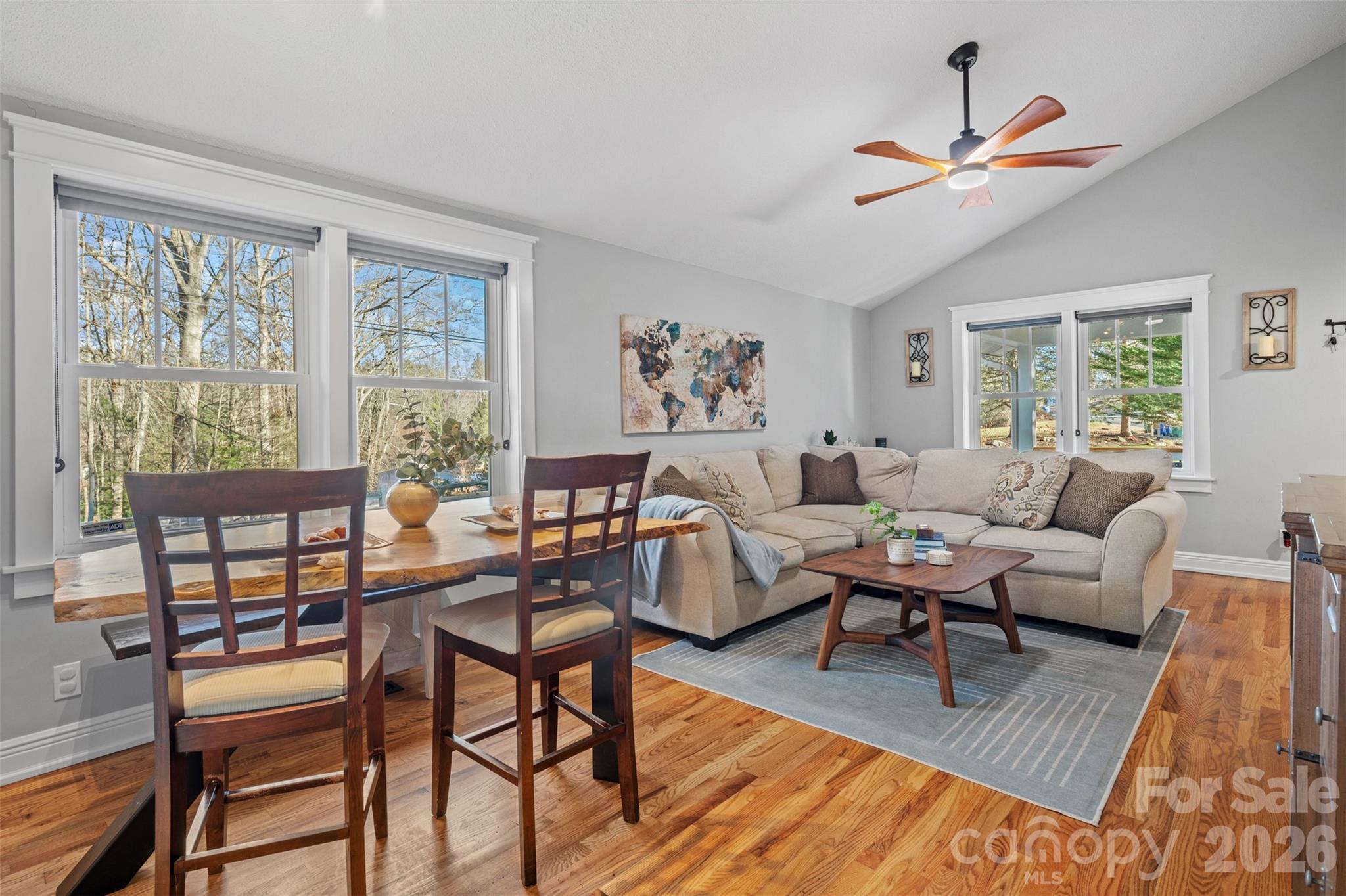 32 Youngs Cove Road Candler, NC 28715 - Photo 6 of 35 a living room with furniture a bed and a painting on the wall